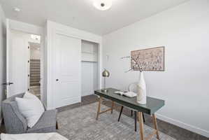 Room featuring light-toned walls and wood-finish flooring