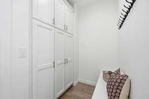 Floor-to-ceiling white shaker cabinetry with brushed nickel hardware