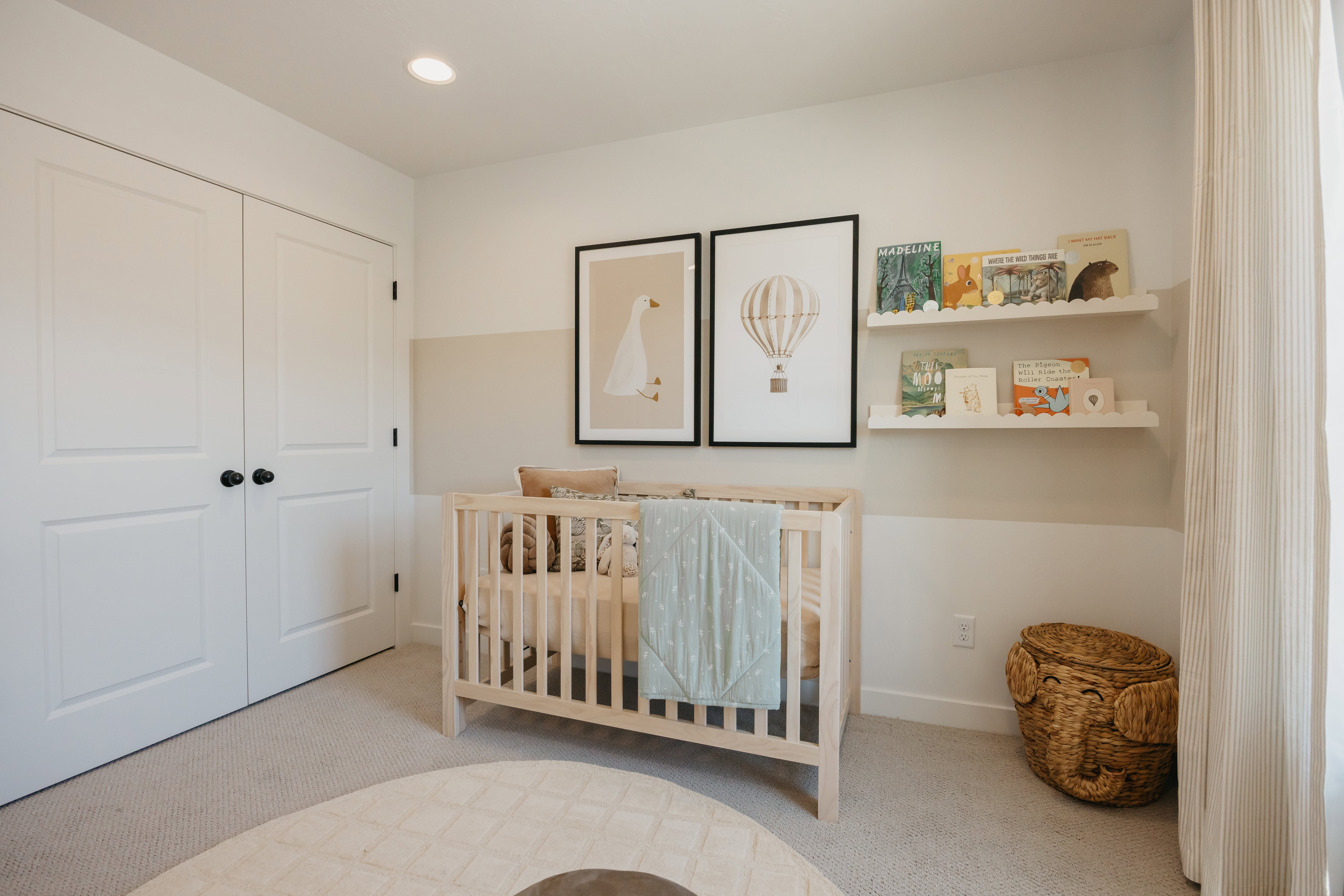 Carpeted room featuring a double-door closet with black hardware, recessed lighting, and wall-mounted shelving