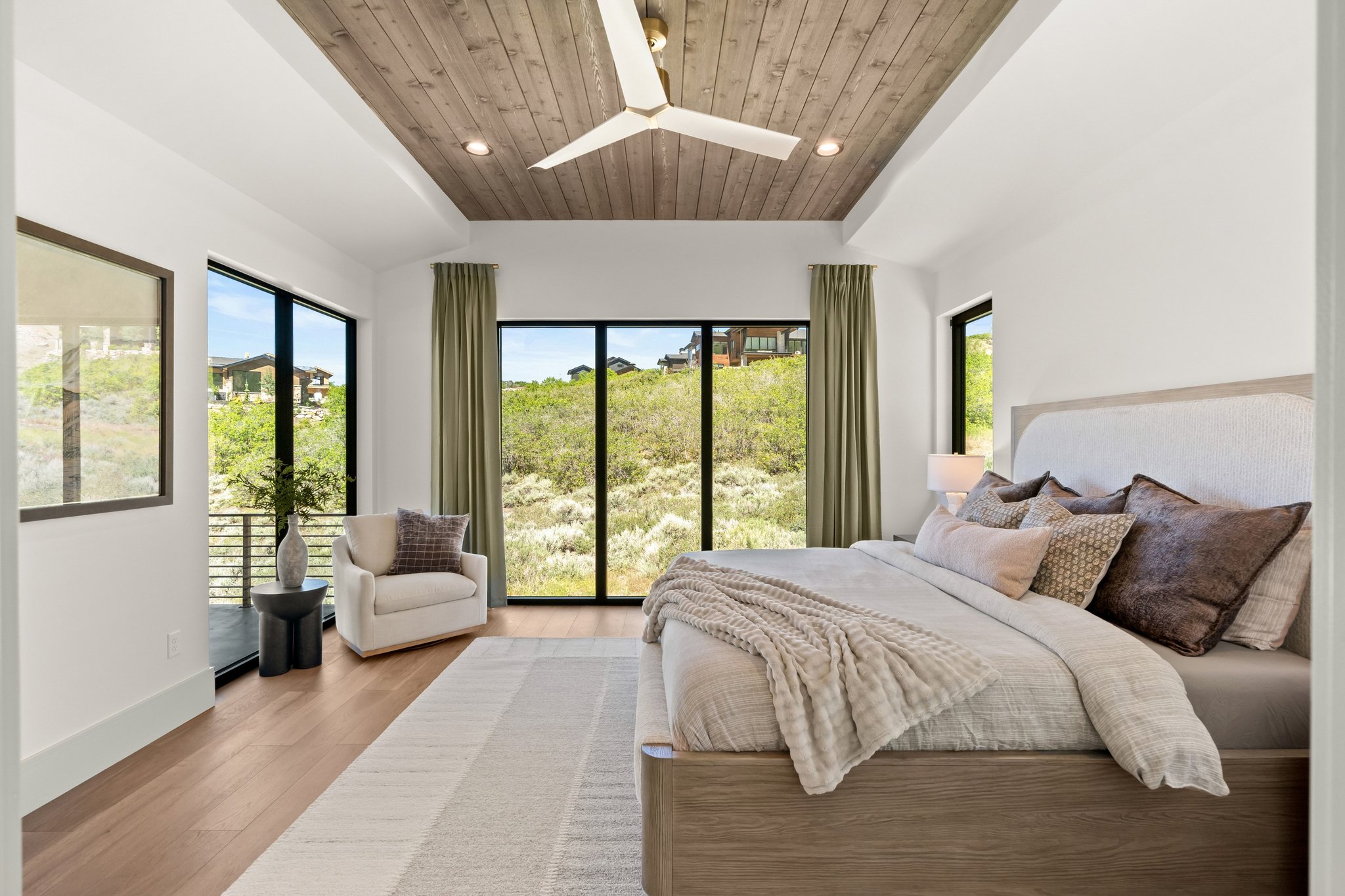 Tray ceiling with wood-finish paneling and recessed lighting