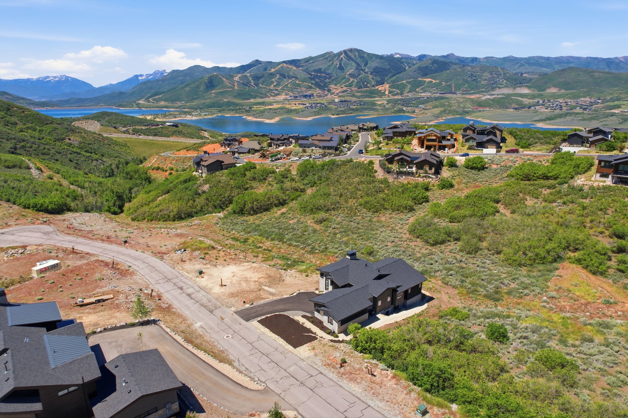 Property featuring a modern architectural design with a dark roof and exterior finishes