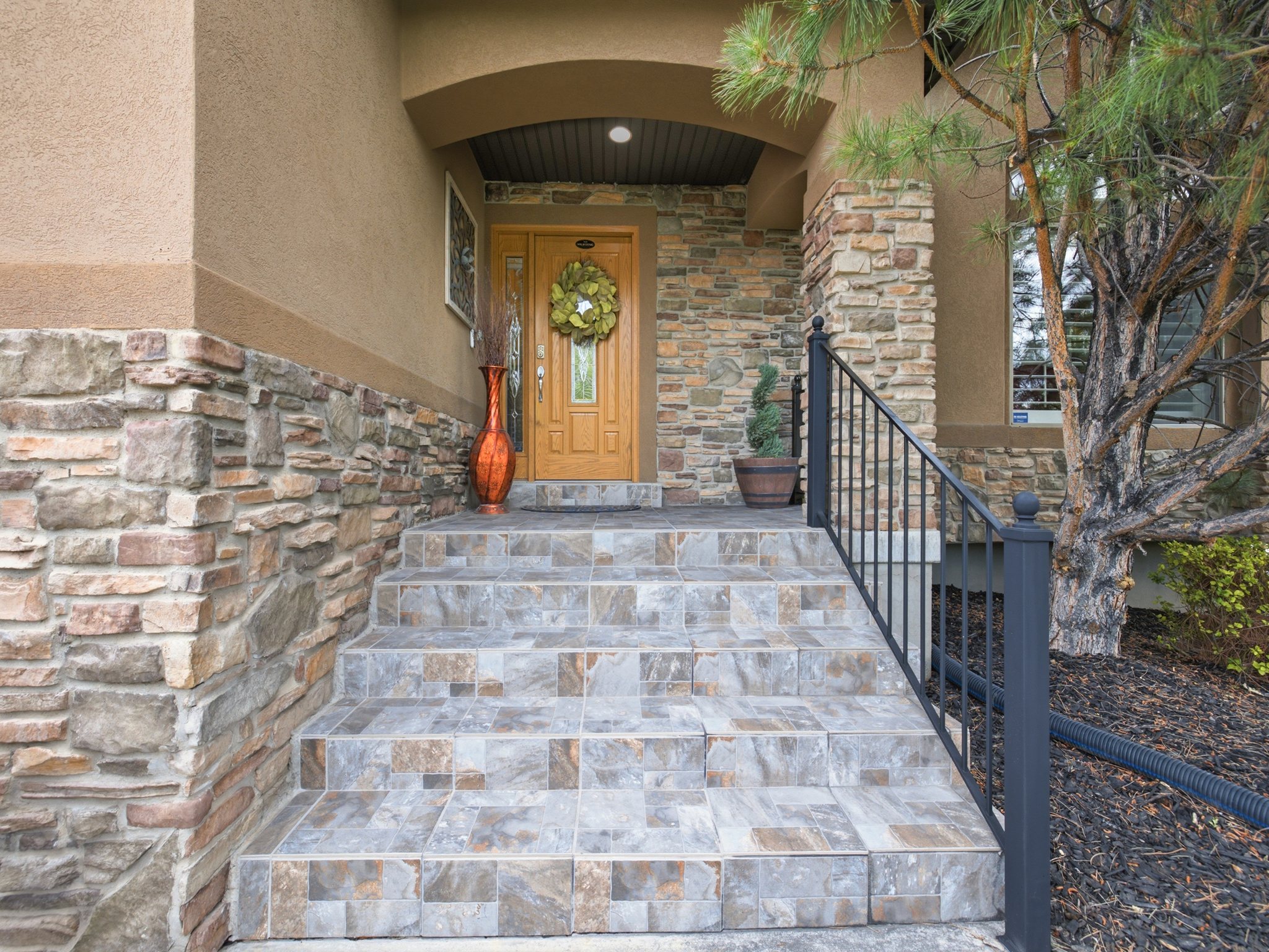 Stucco exterior accented with stone detailing