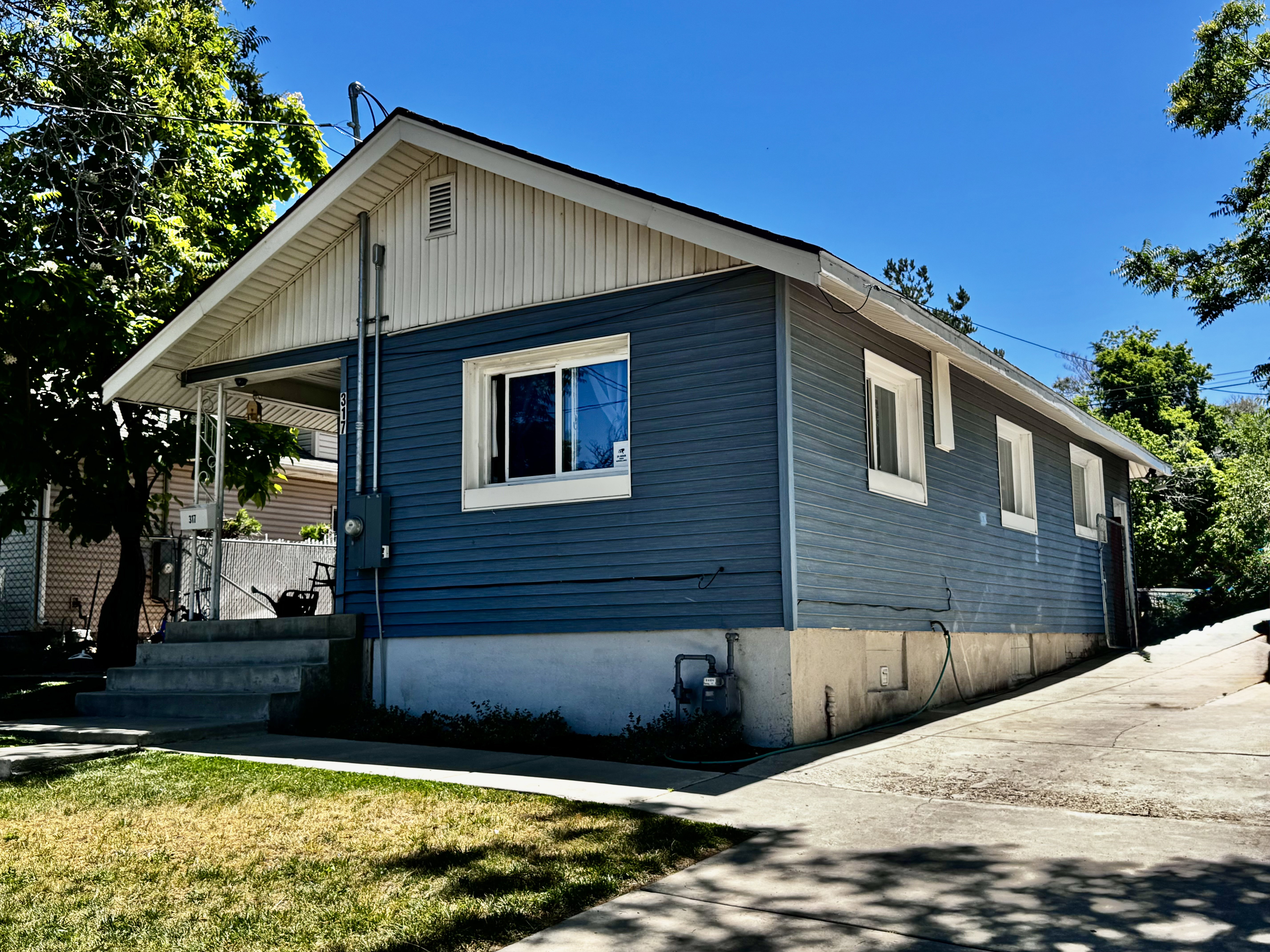 Side view Rambler Style 3 bed - 2 bath home, with parking for 6 vehicles
