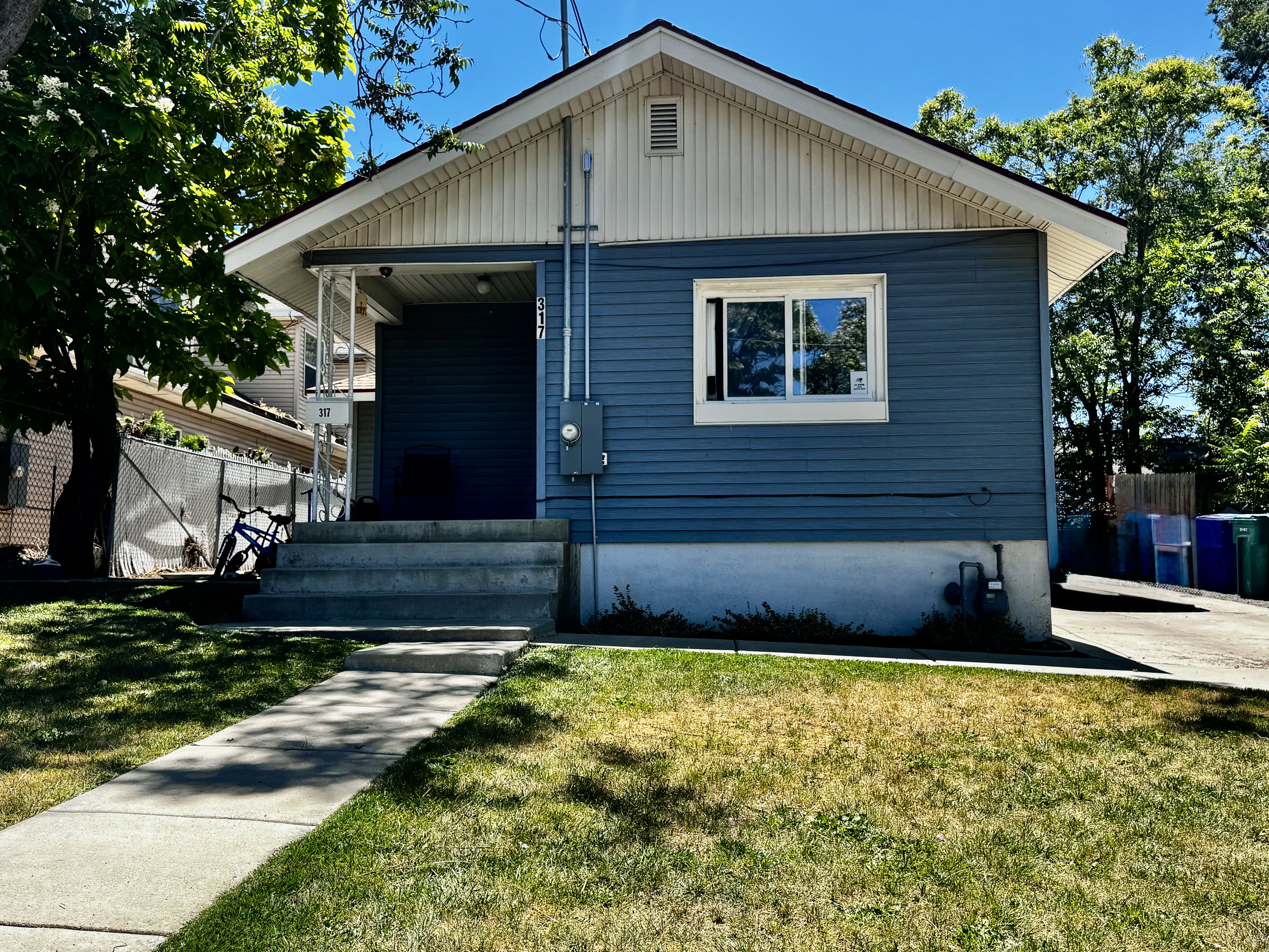 Blue exterior siding with white trim detailing