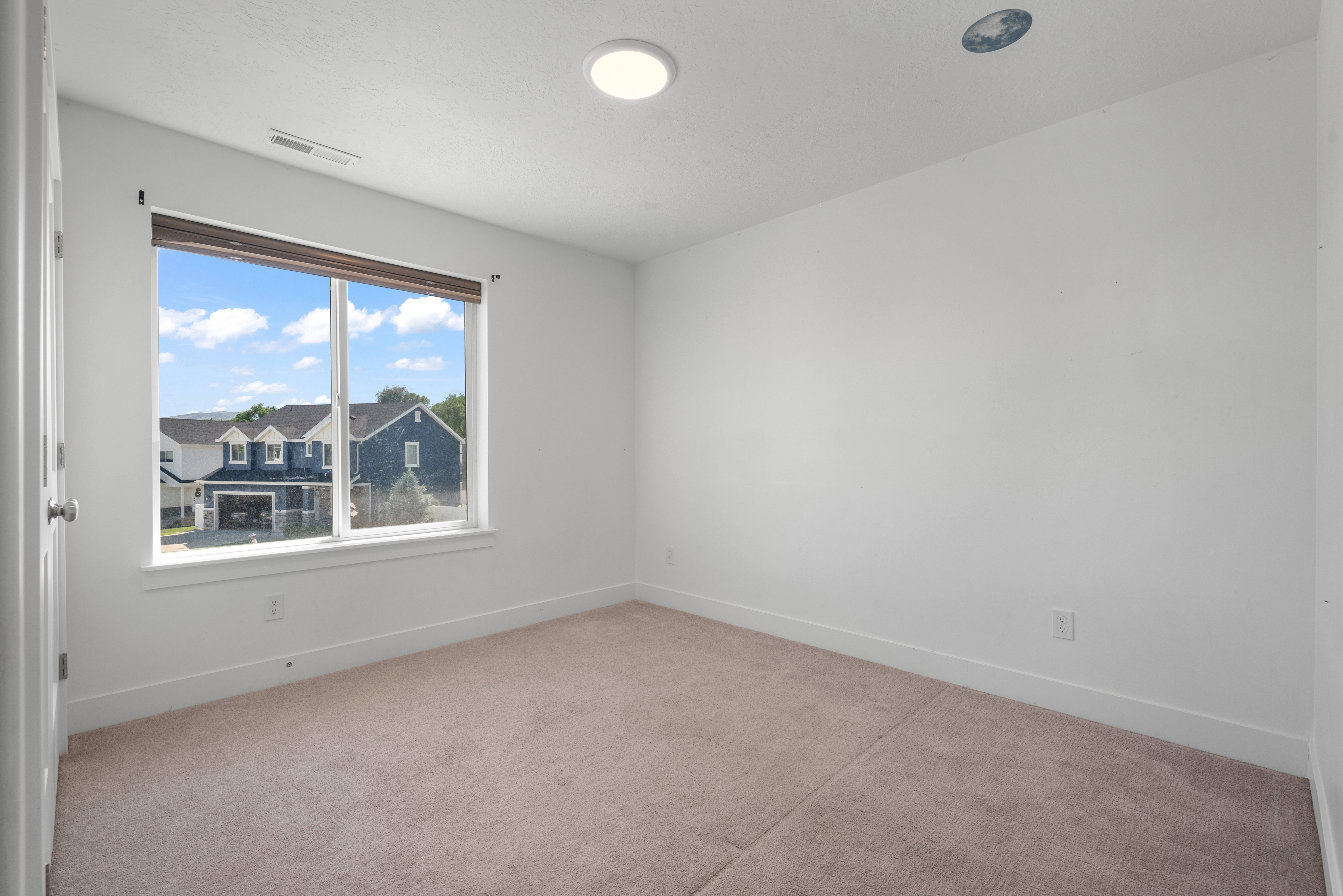 Room with carpet flooring and white walls