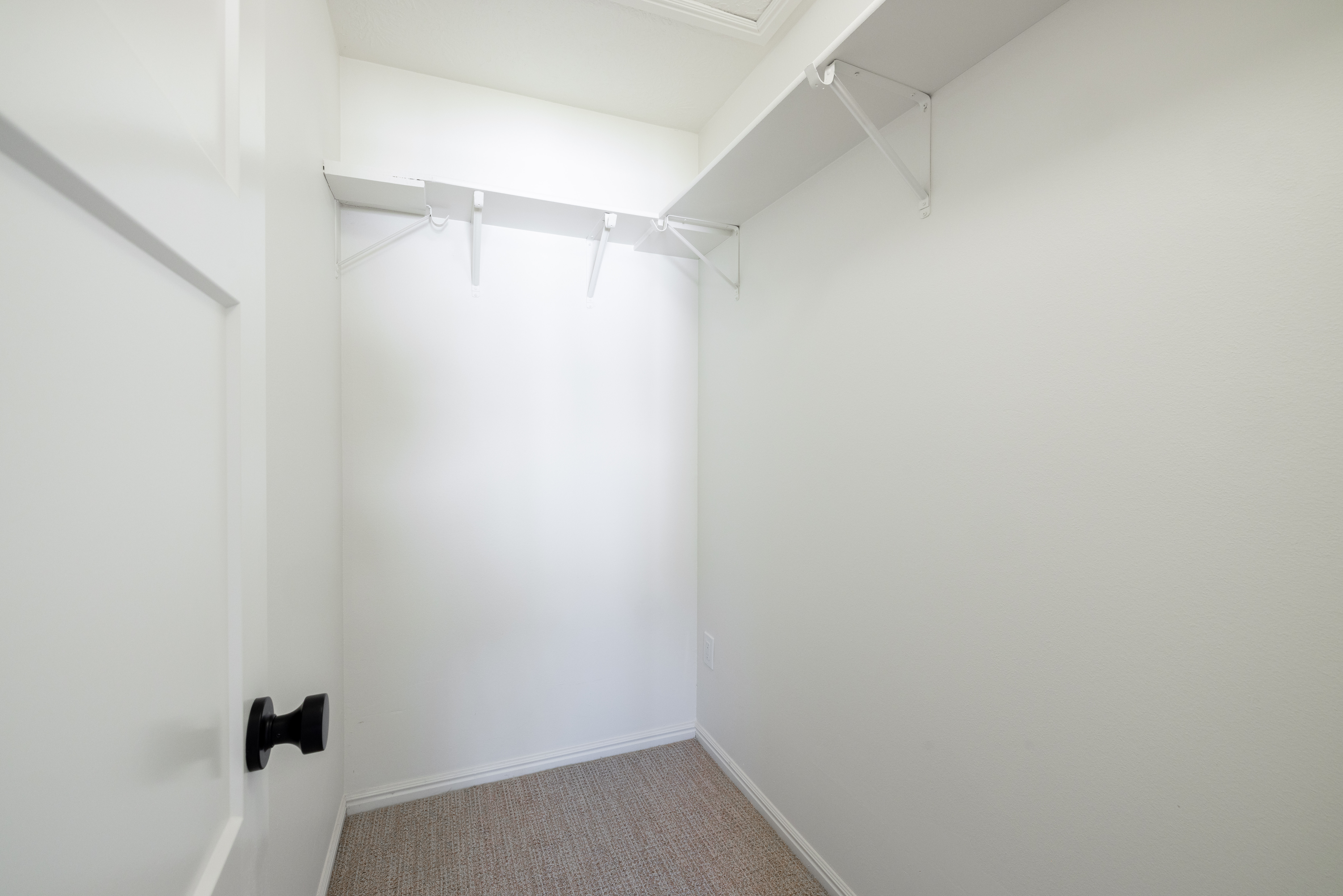 Walk in closet in primary bedroom