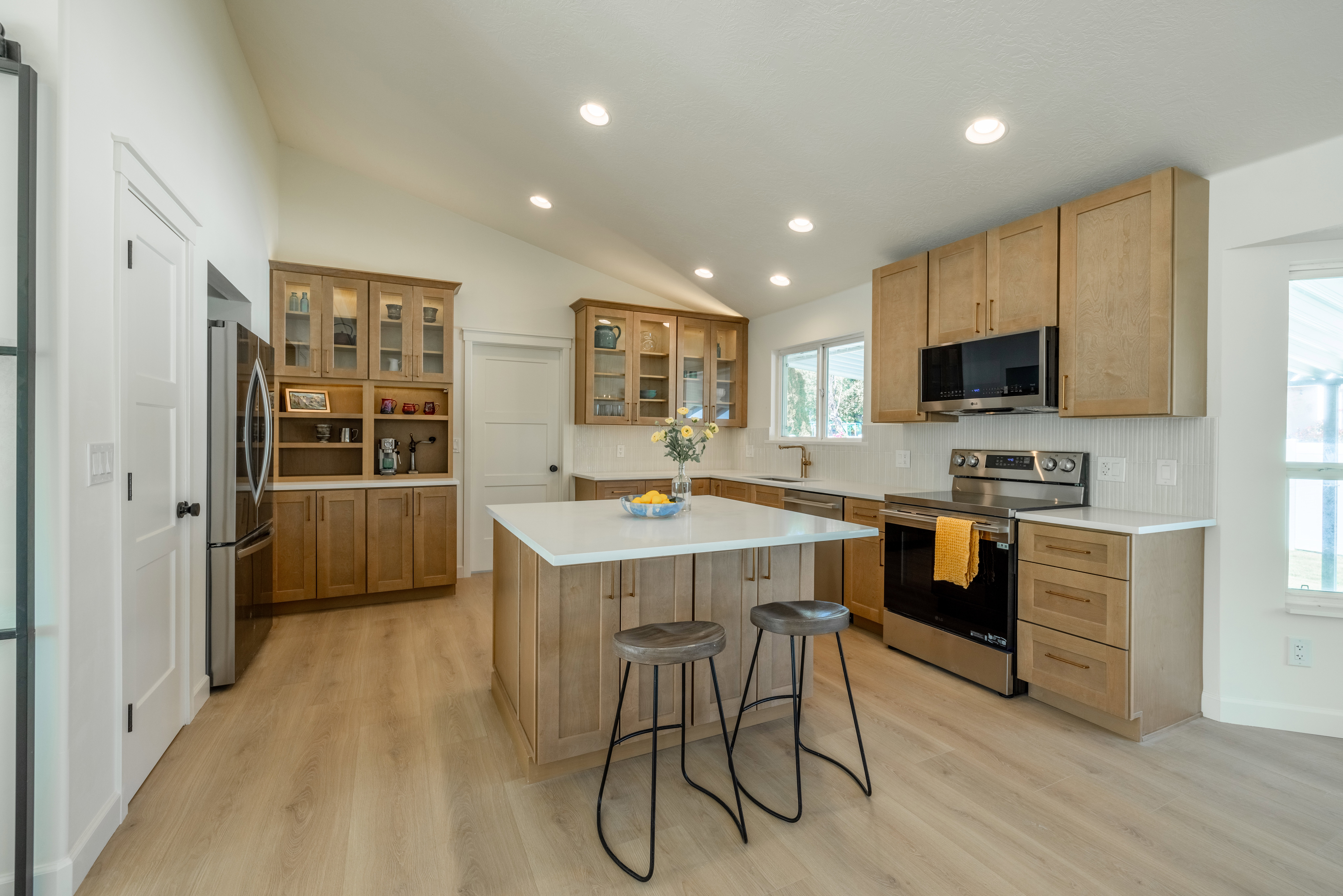 Kitchen with soft close wood cabinets and quartz countertops