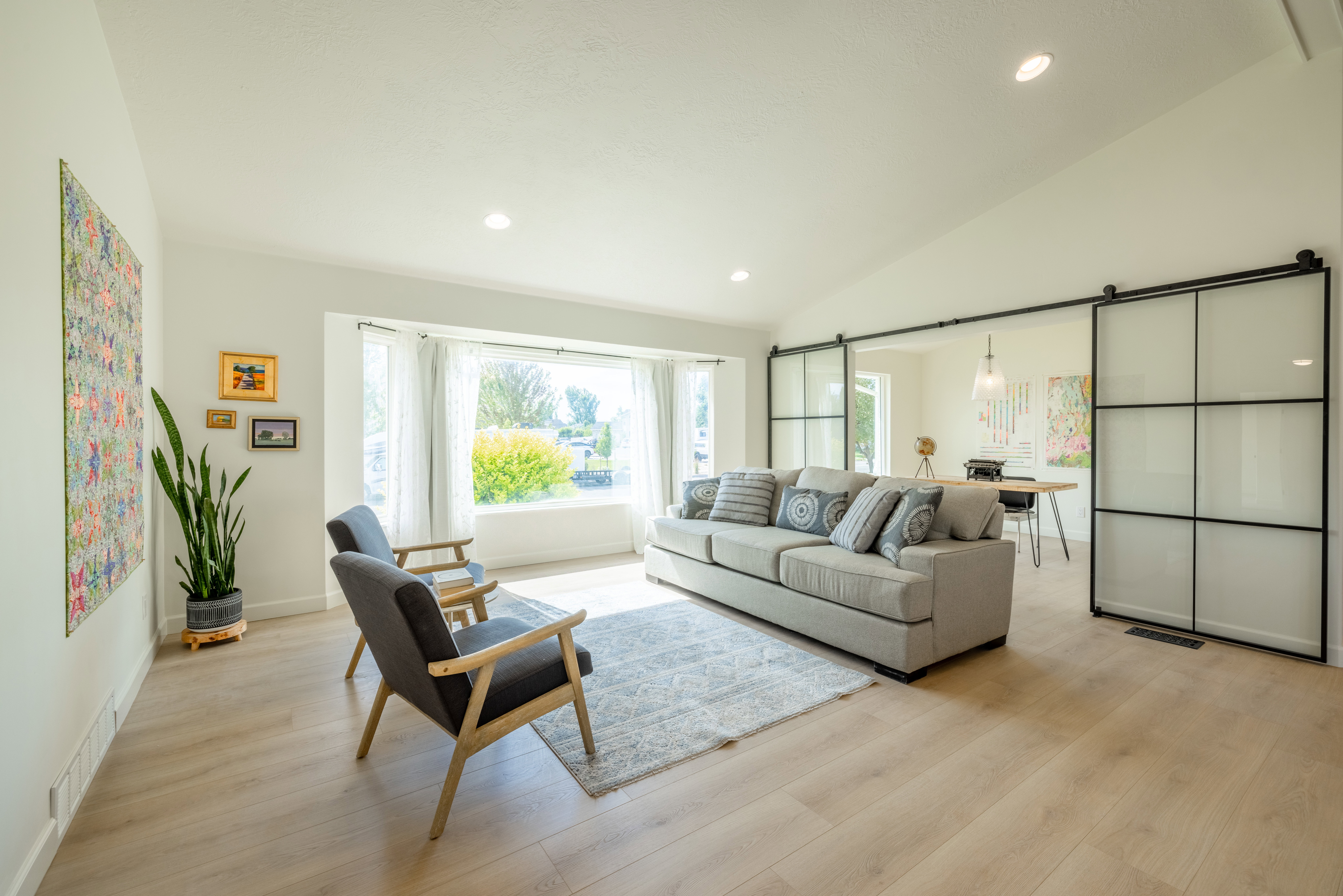 Great room with study featuring glass and metal doors