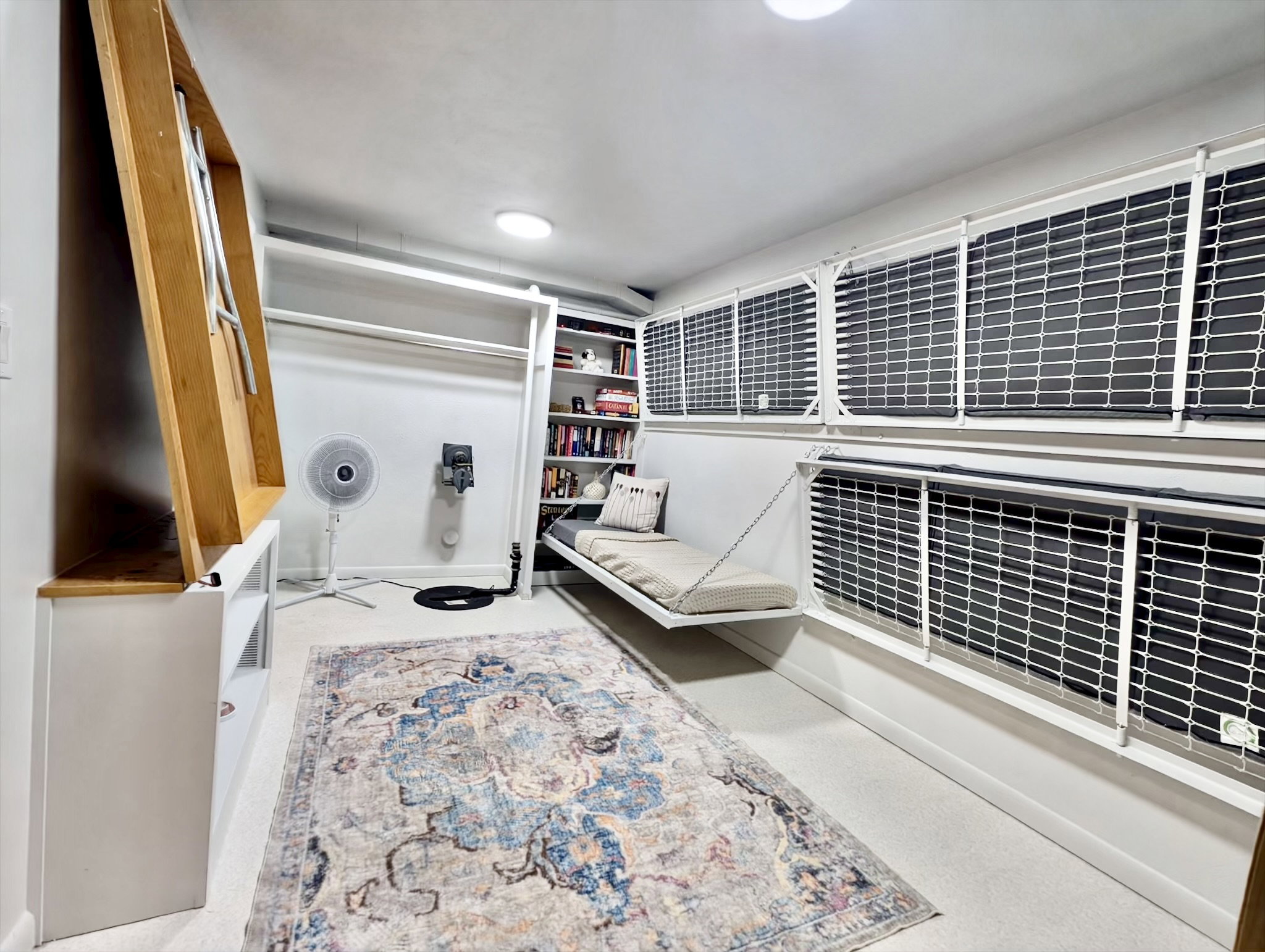 Multi-function room fwith built-in shelving.  The room is equipped with bunk beds and a craft table that can be folded up to make the room fit your needs.
