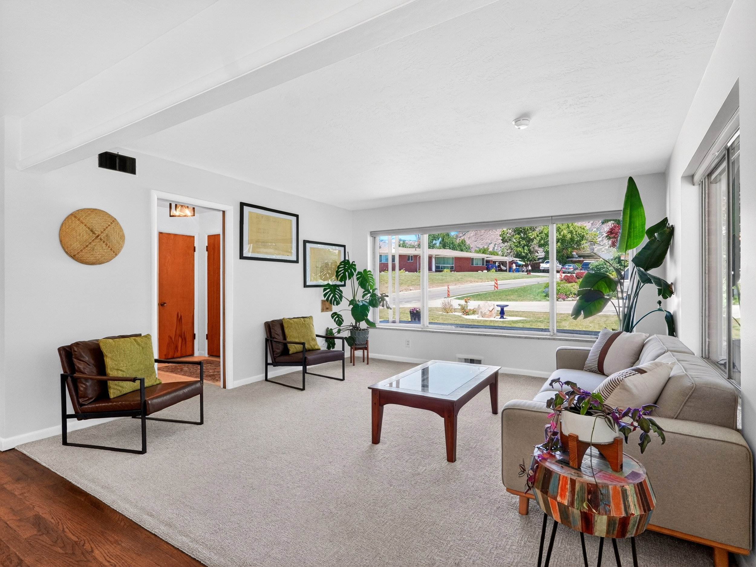 Bright open-concept living space featuring expansive windows