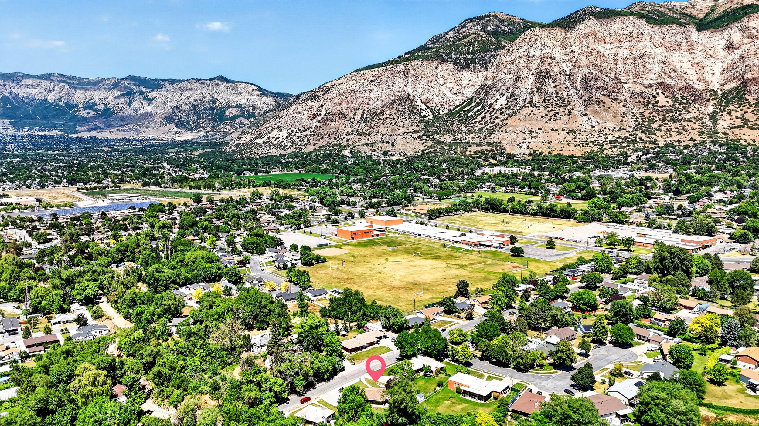 Aerial view showing quiet street and proximity school and park