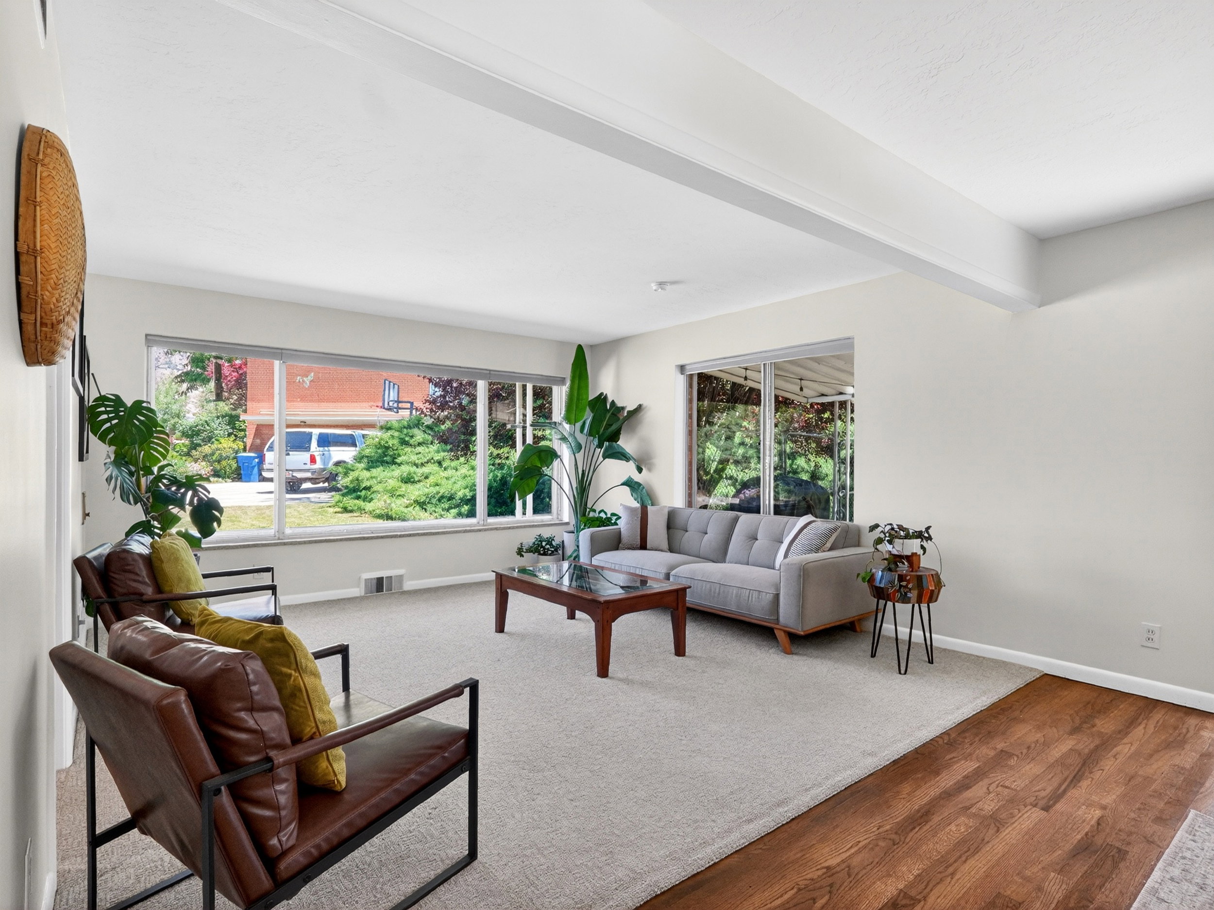Bright open-concept living space featuring expansive windows