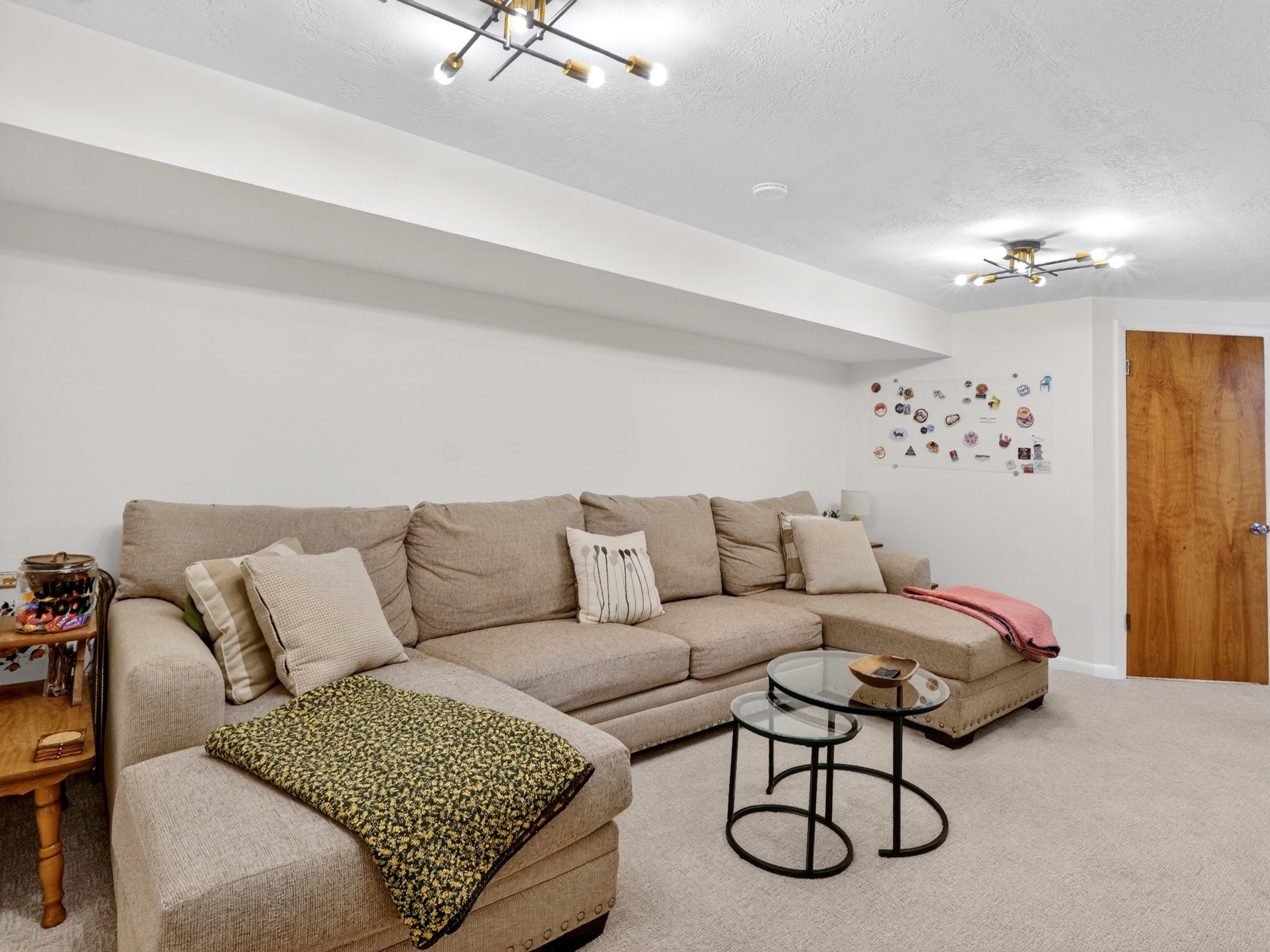 large basement living room with bathroom.