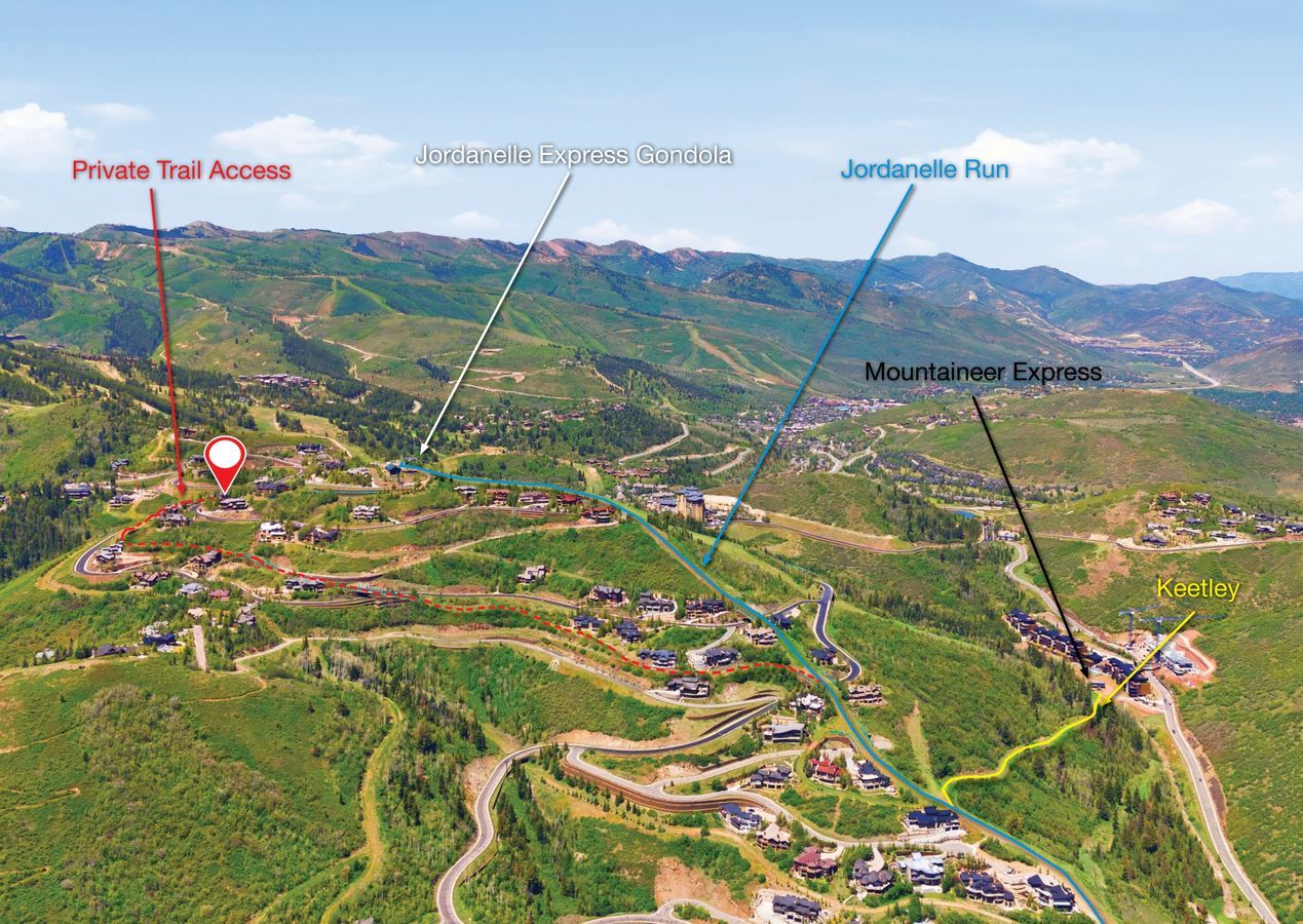 Mountain landscape featuring multiple residential properties and ski runs