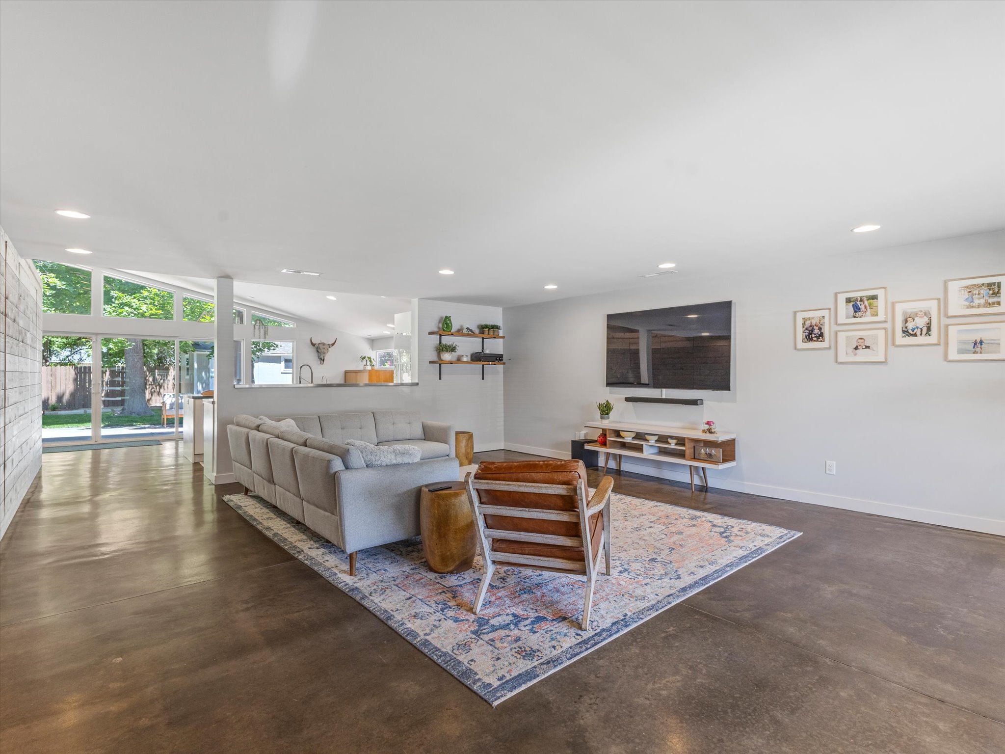 Floor to ceiling windows  along the entire back wall of the house