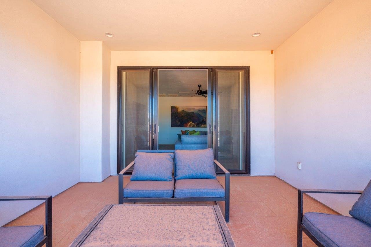 Covered patio featuring recessed lighting, smooth stucco walls, and large sliding glass doors