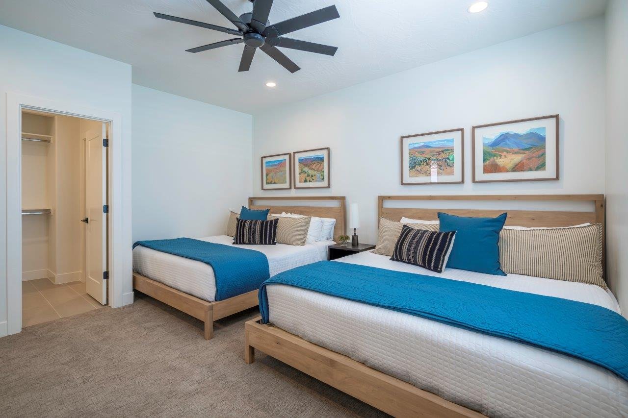 Neutral color palette bedroom featuring recessed lighting, a modern ceiling fan, plush carpeting, and a built-in closet with shelving
