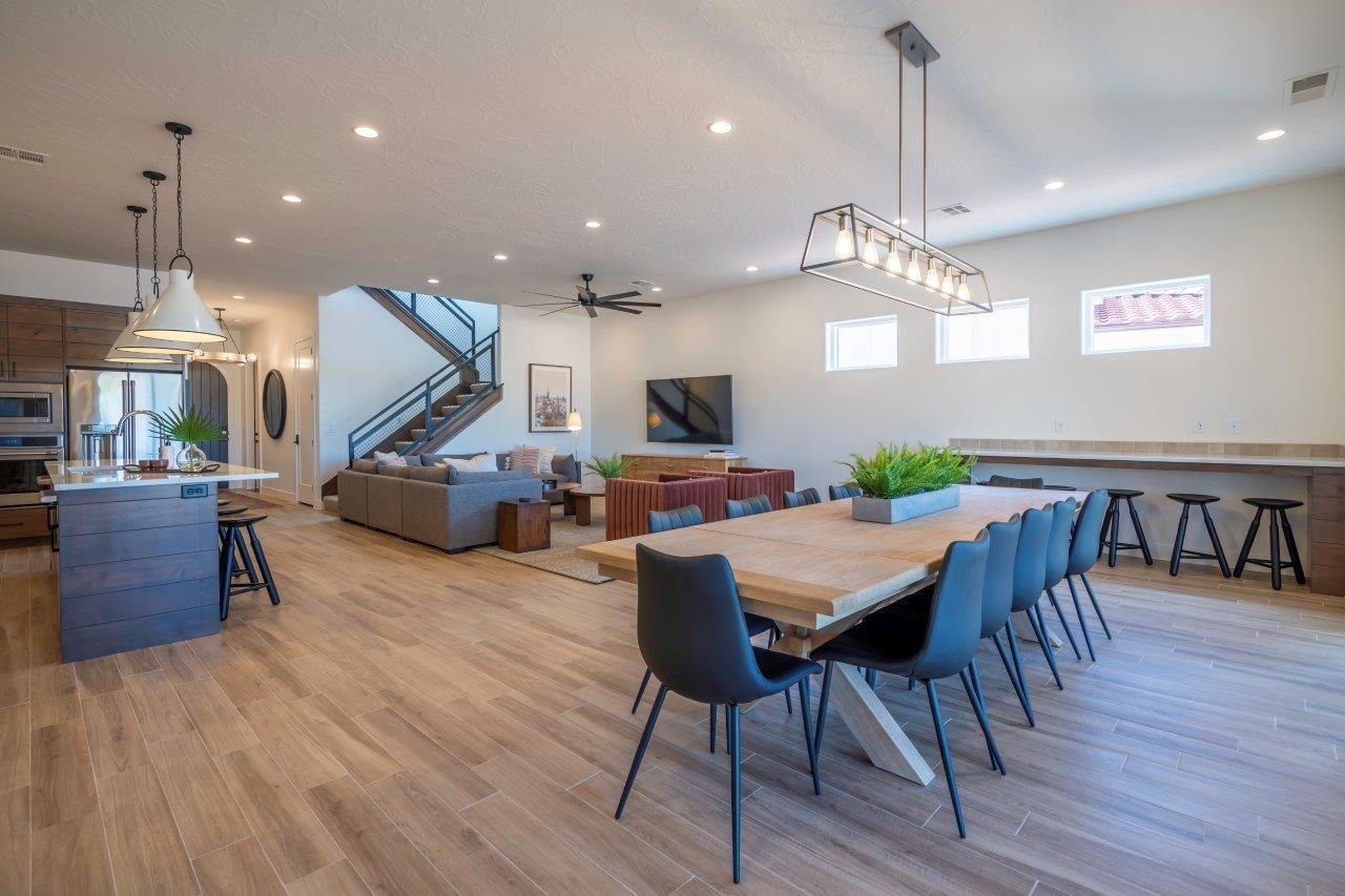 Spacious open-concept interior featuring light wood-finish flooring throughout