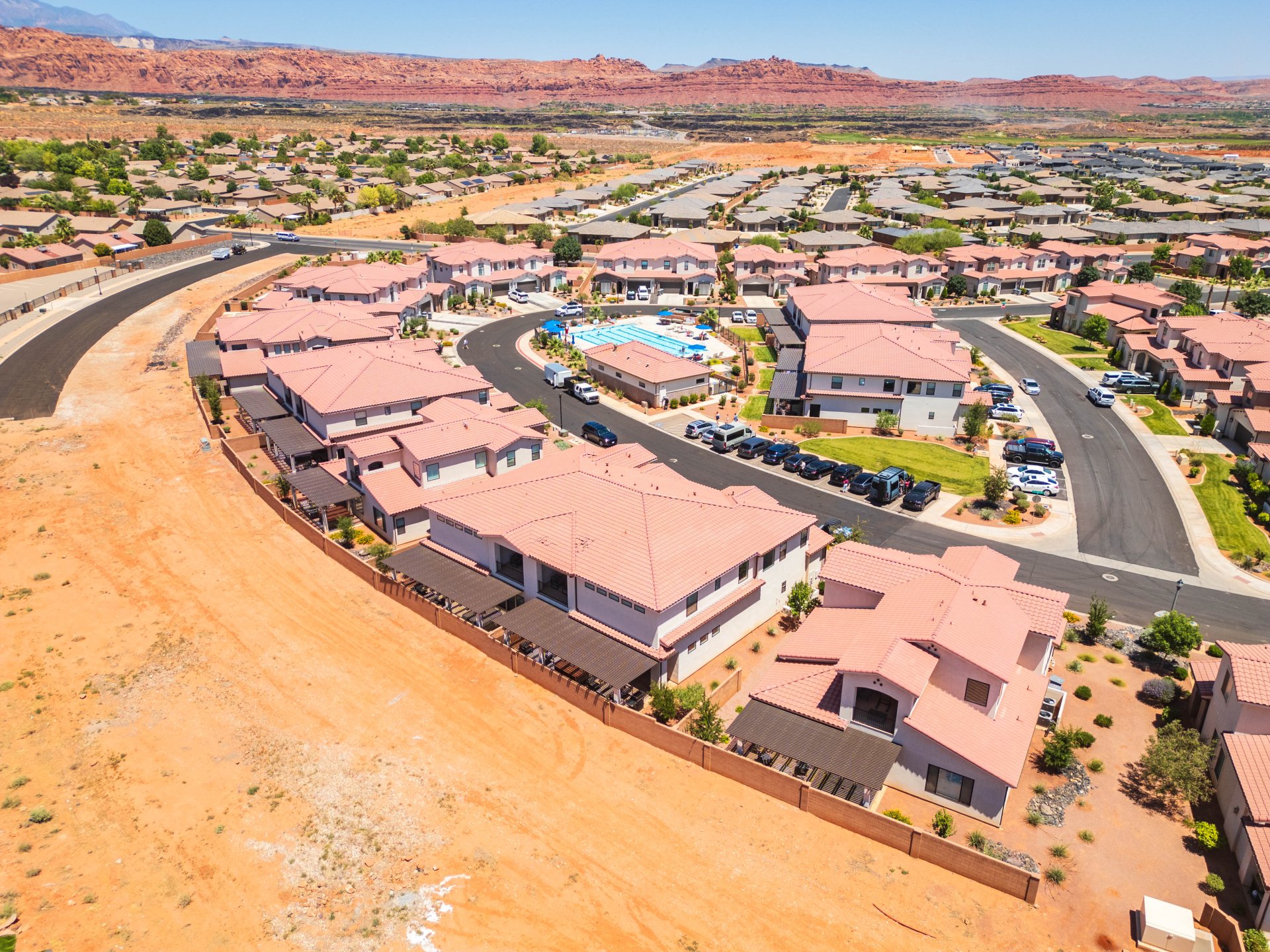 Aerial perspective showcasing a residential community with red-tiled roofs