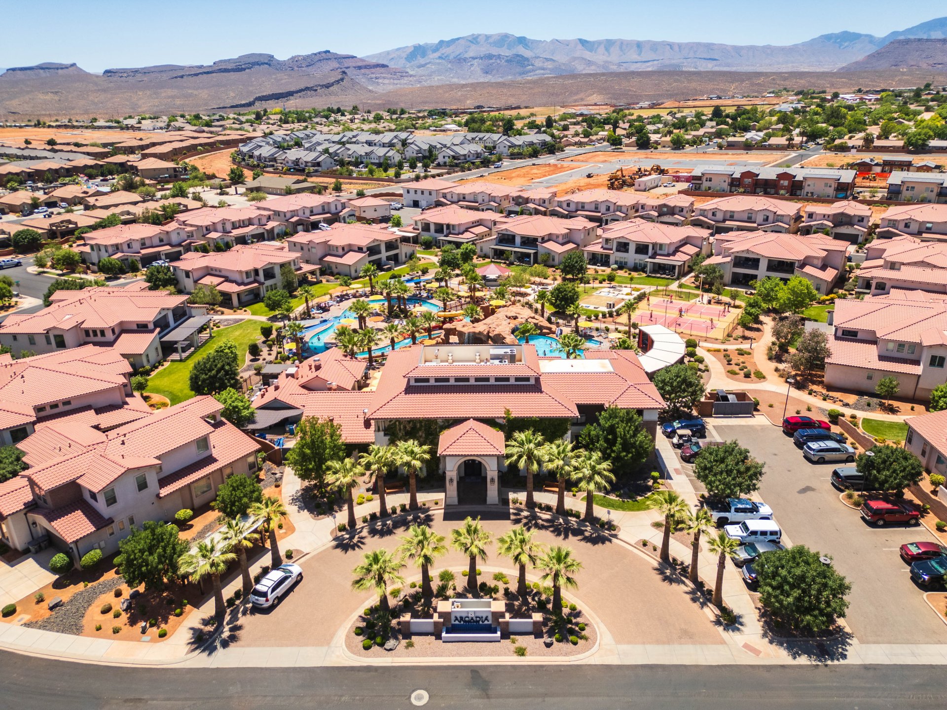Aerial perspective showcasing a residential community with red-tiled roofs