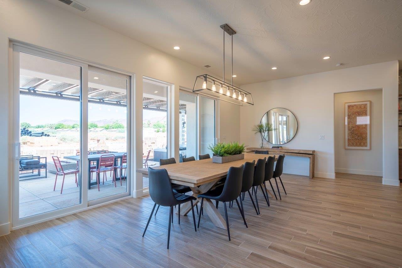 Spacious dining area featuring extensive natural light from multiple sliding glass doors