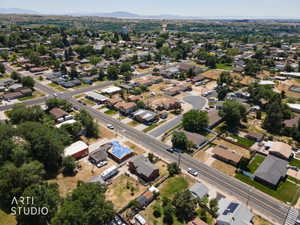 Aerial overview of a residential neighborhood with a mix of established homes and undeveloped lots