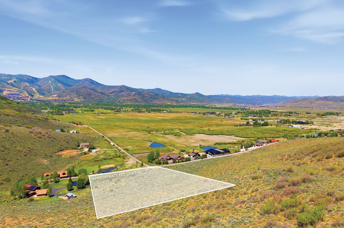 Expansive undeveloped lot with a mountainous backdrop