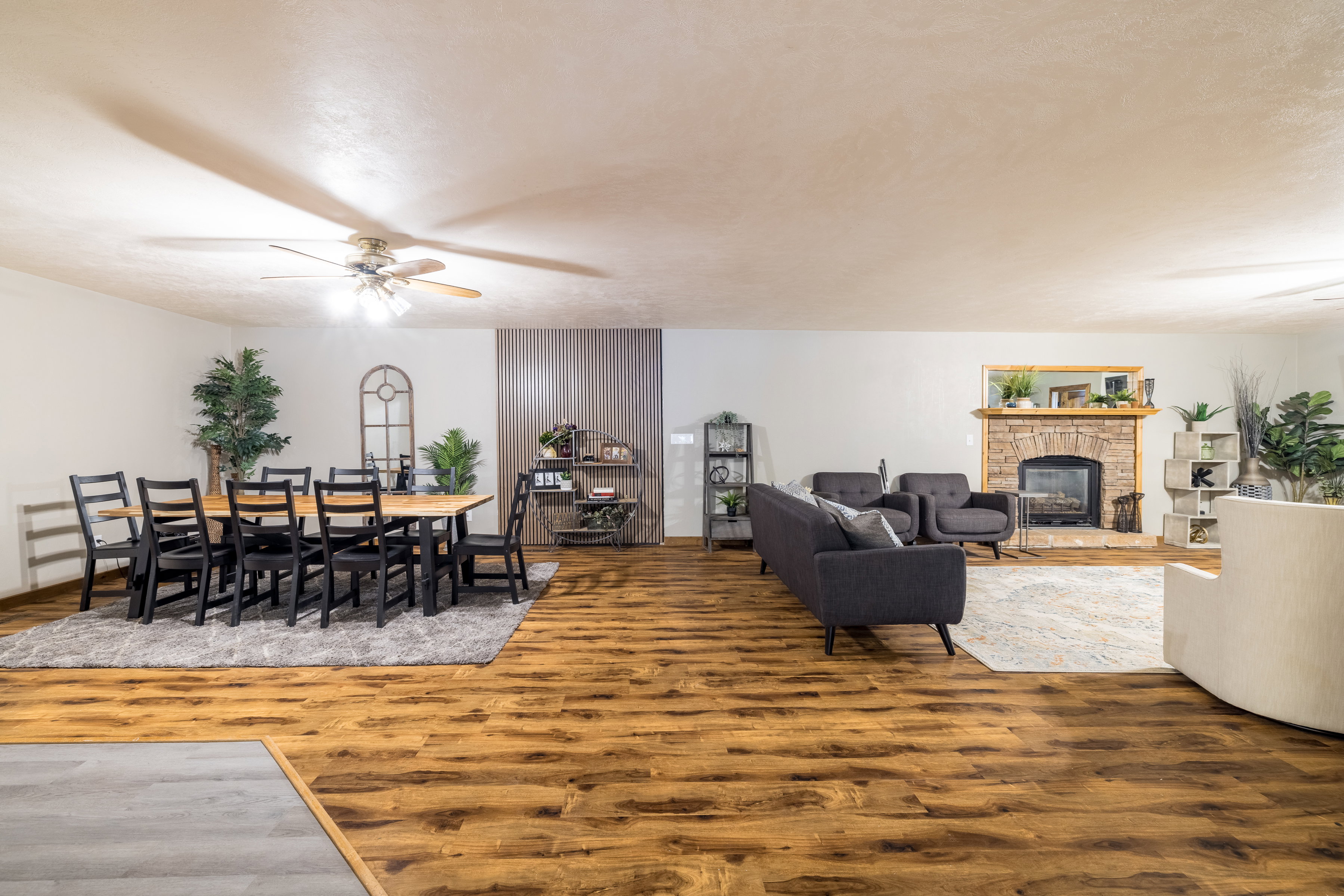 Spacious room featuring wood-finish flooring throughout
