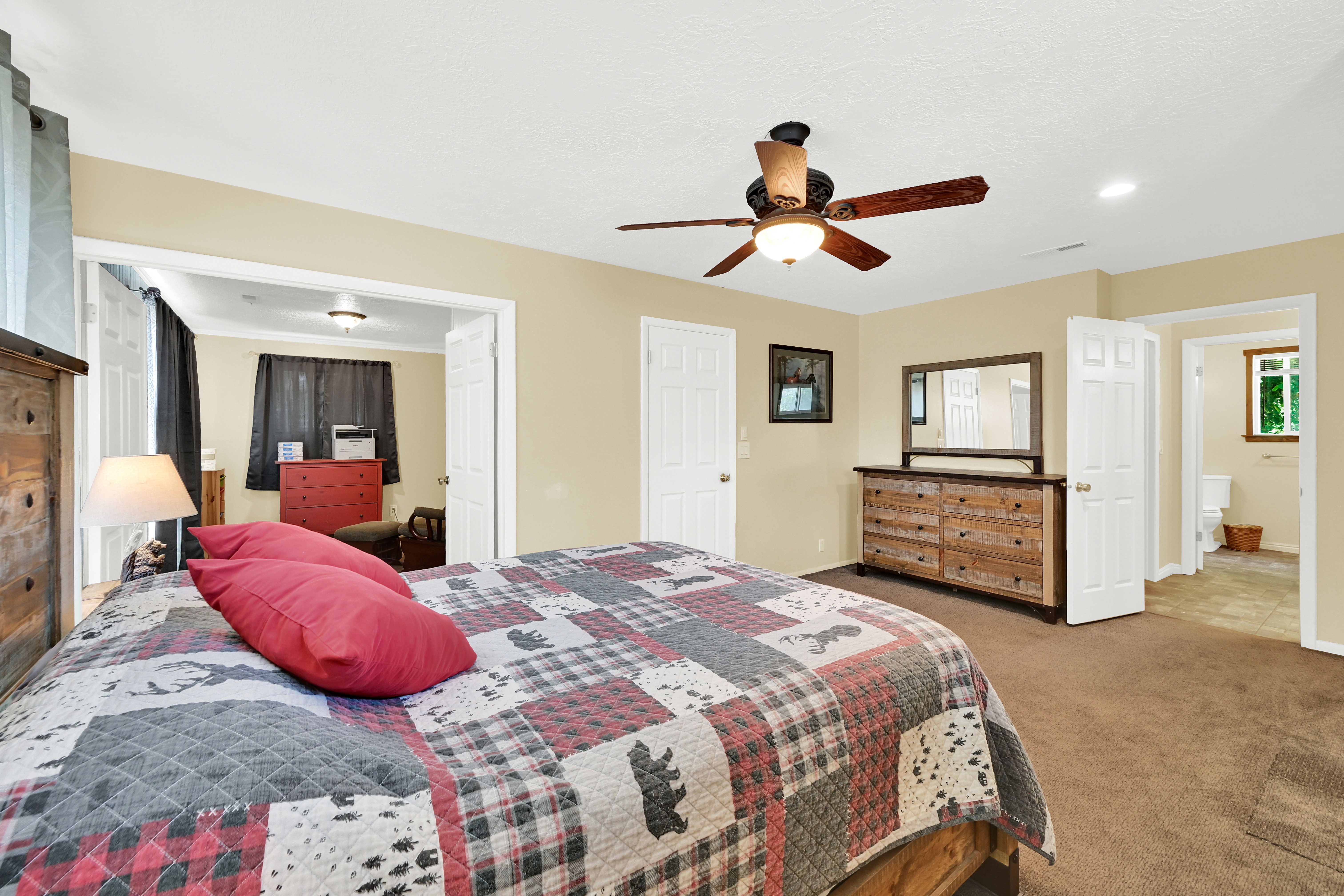 Carpeted bedroom featuring a ceiling fan with light fixture, recessed lighting, and a neutral wall color
