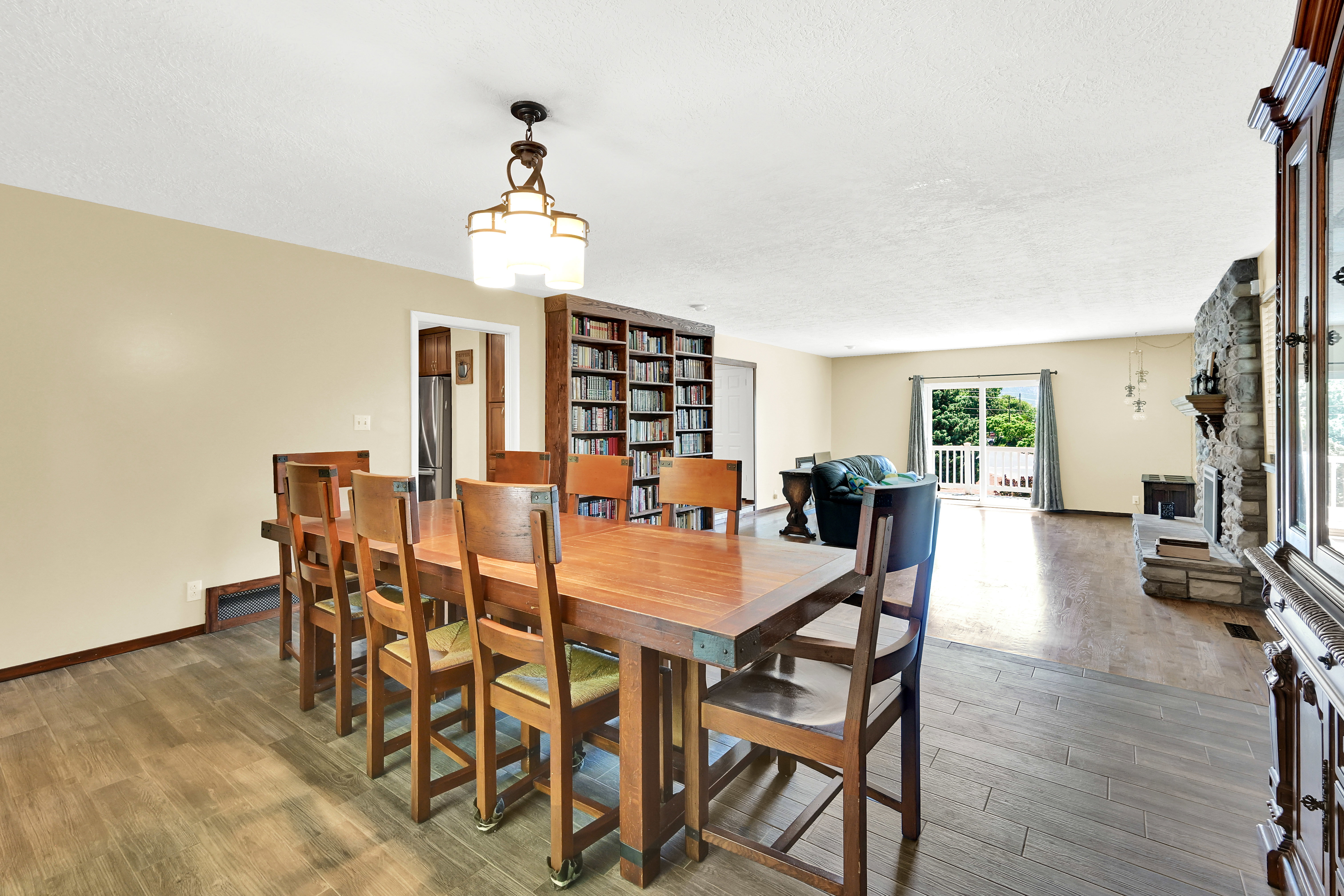 Open concept interior with wood-finish flooring extending into the background