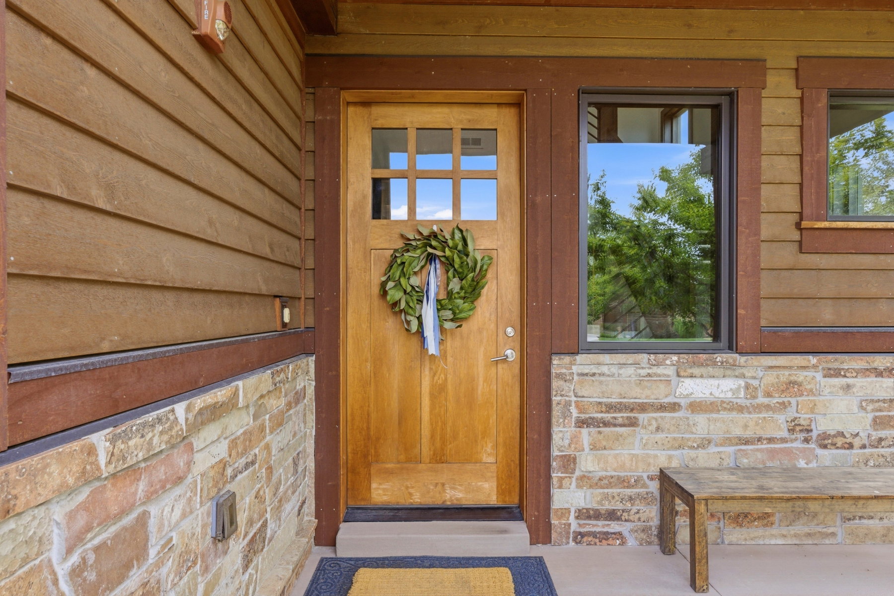 Craftsman-style entry door with divided lites and brushed nickel hardware