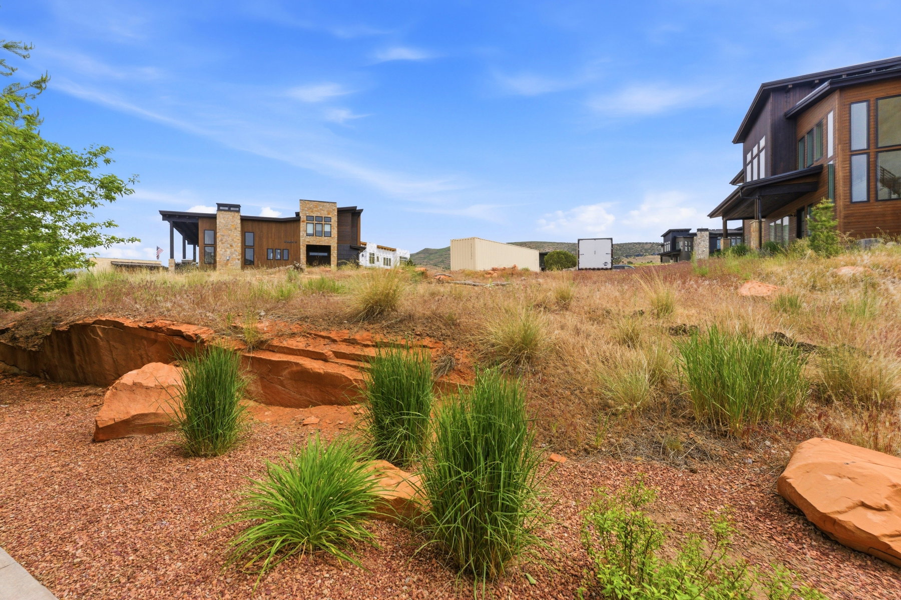 Modern residence with wood siding and stone accents