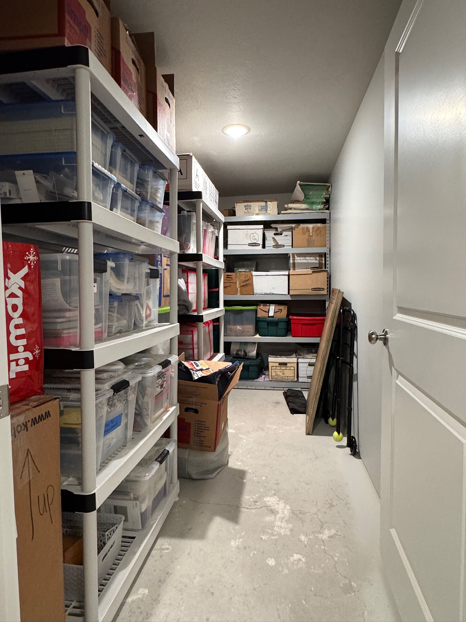 Dedicated storage room featuring concrete flooring and recessed lighting