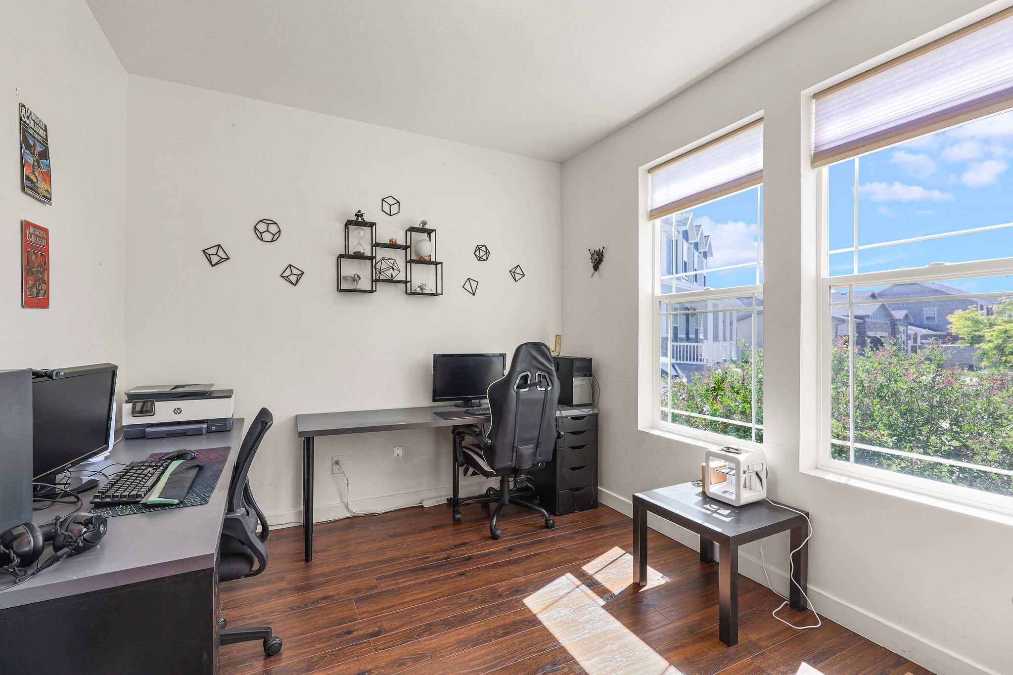Bright room featuring two large windows with white frames and privacy blinds