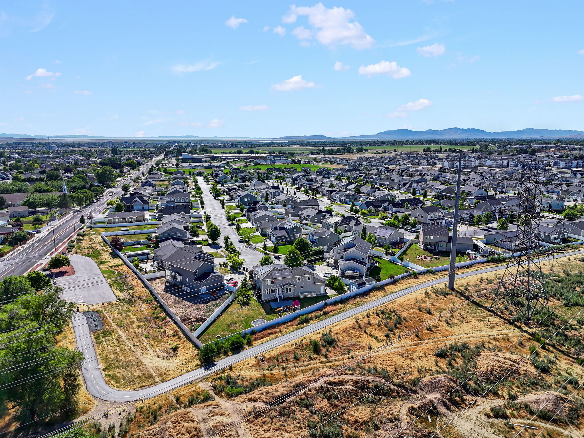 Expansive residential neighborhood featuring numerous single-family homes with pitched roofs and established landscaping