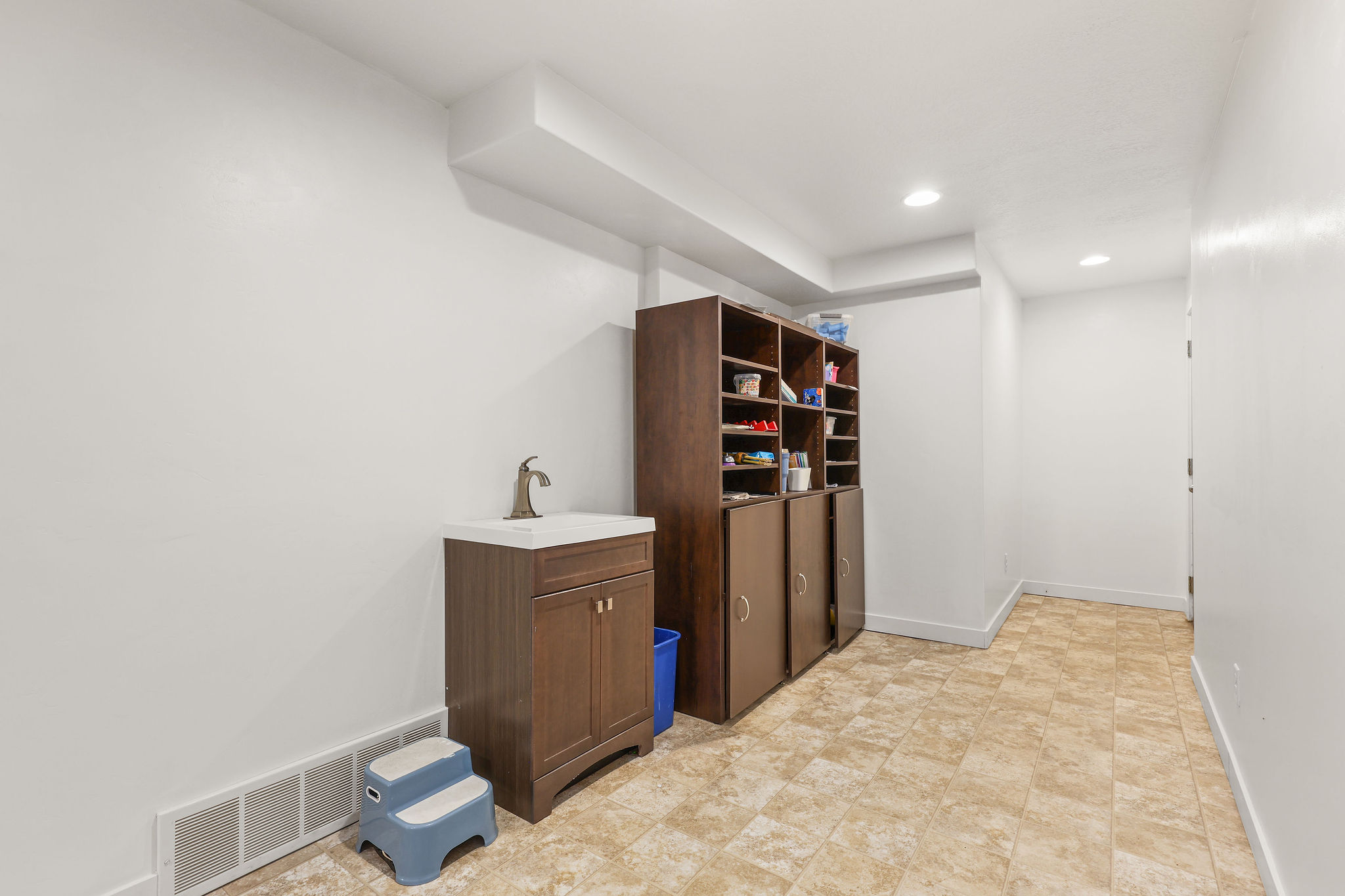 walk out basement area with a vanity sink
