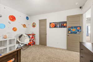 Carpeted room with a solid-core interior door