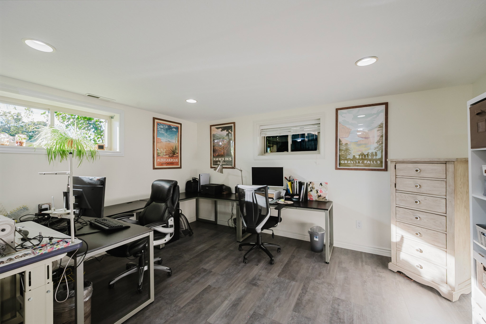 Room featuring wood-finish flooring, recessed lighting, and multiple windows