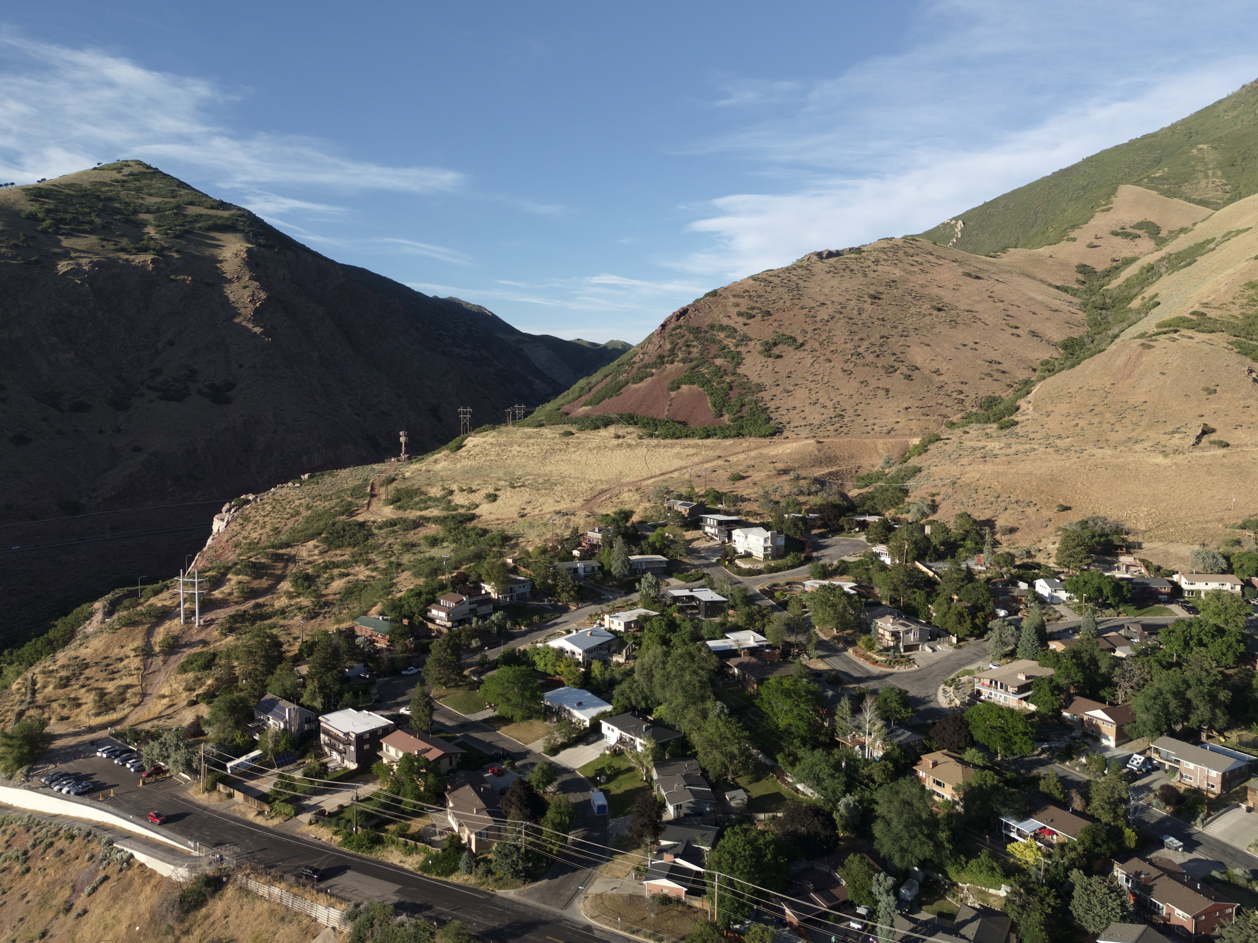 Residential area situated at the base of expansive, natural hillsides