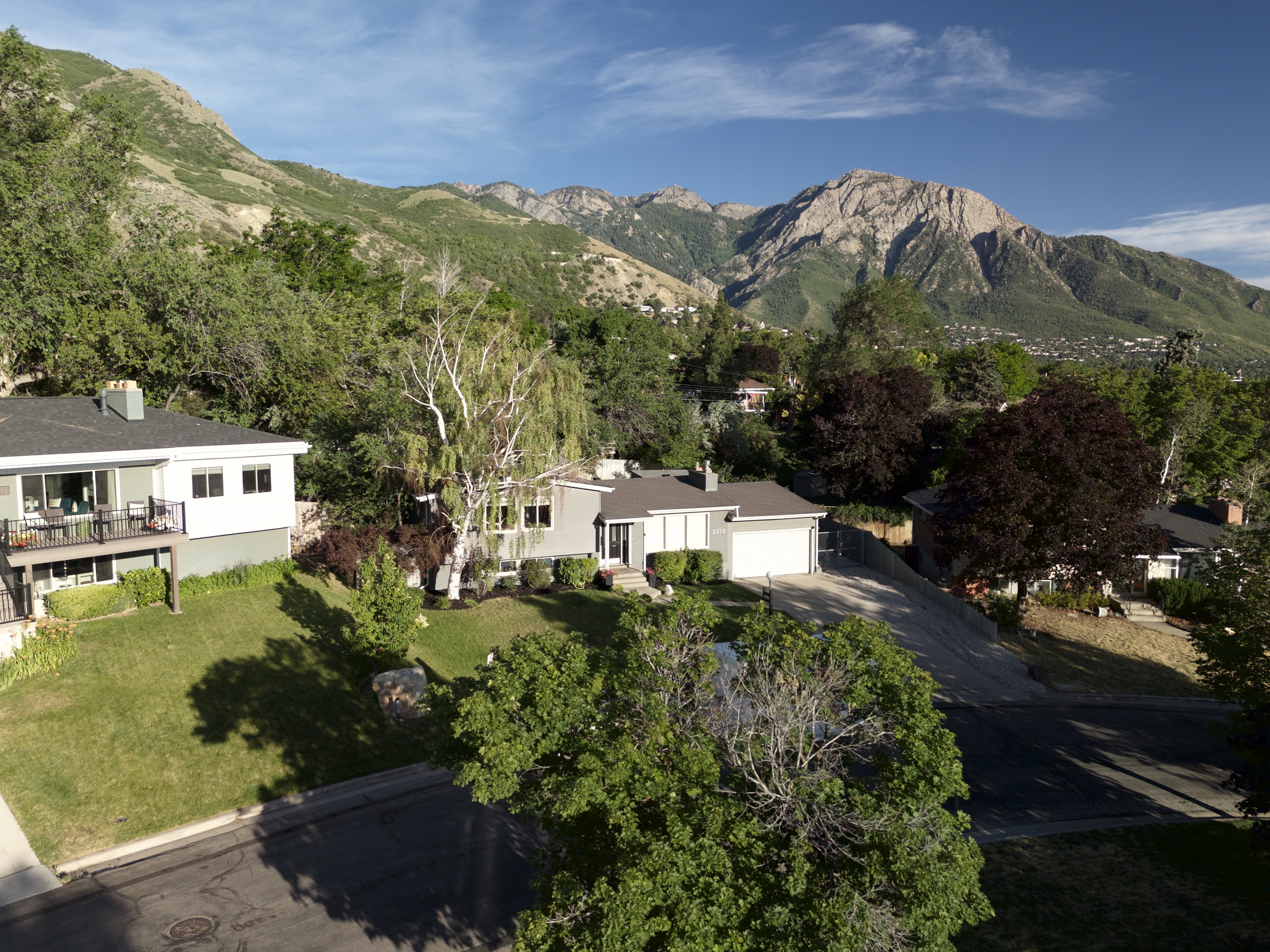 Single-story residence featuring a two-car garage and a paved driveway