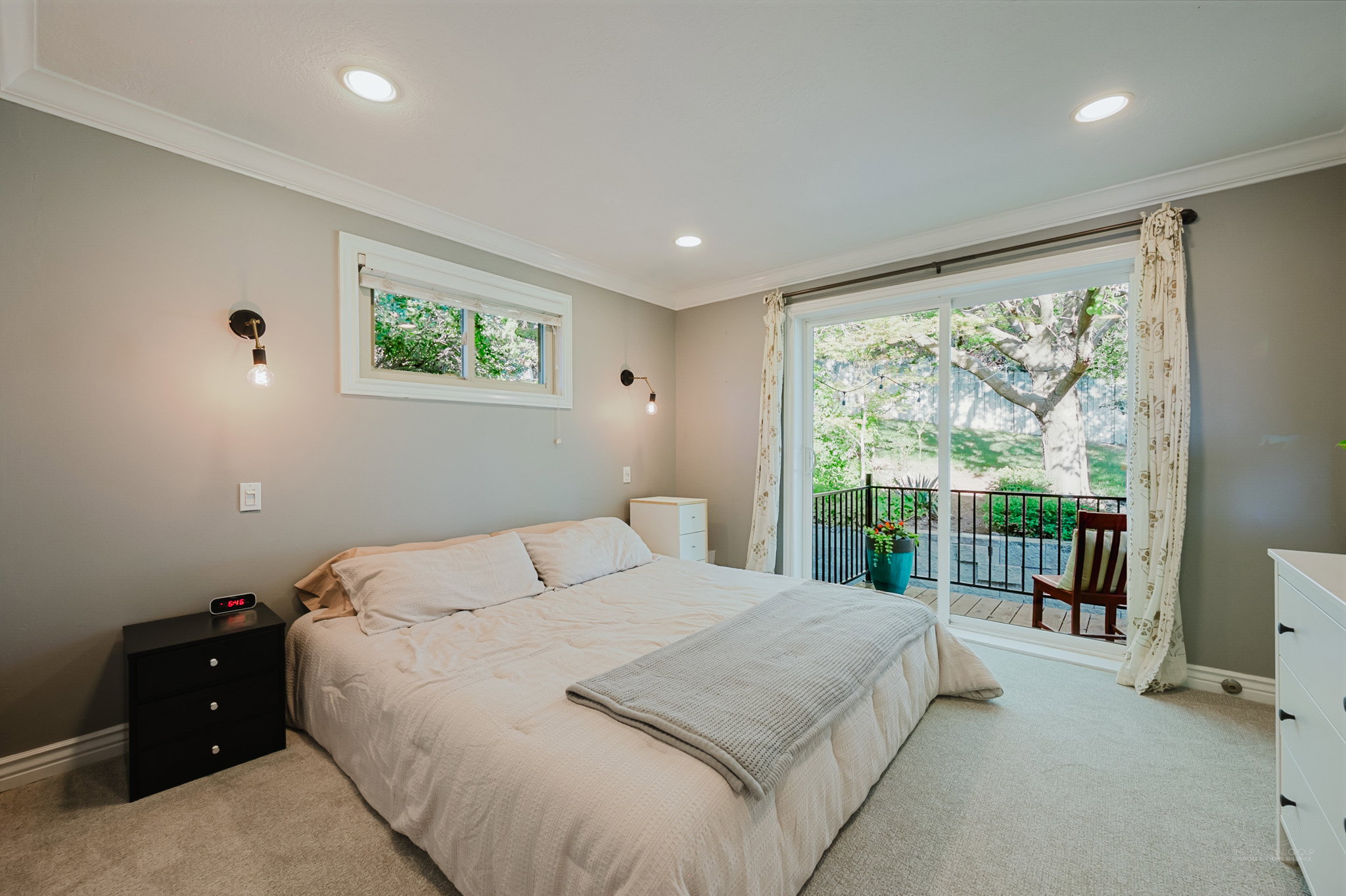 Recessed lighting and ceiling crown molding accent the space