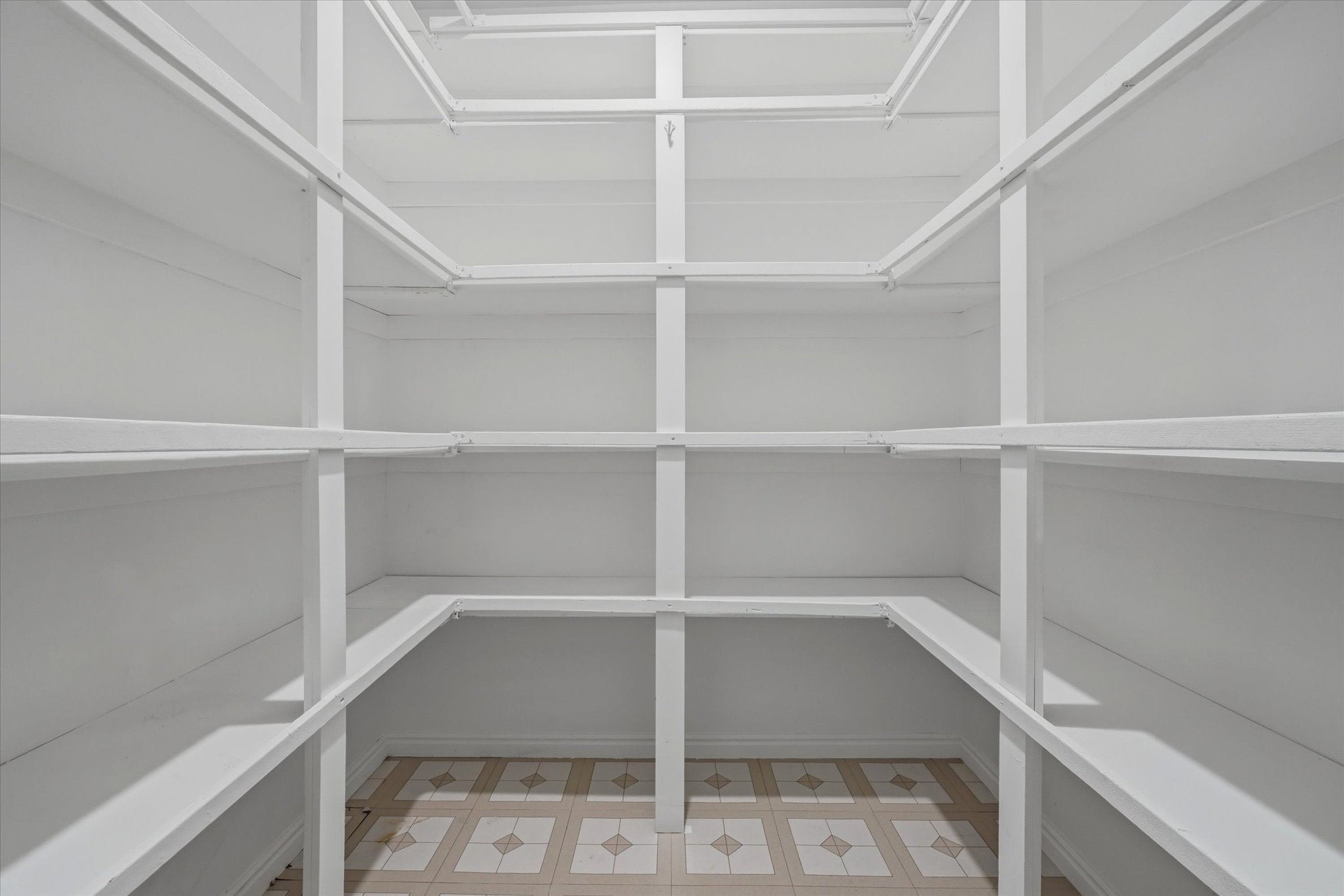 Built-in shelving system with white finish