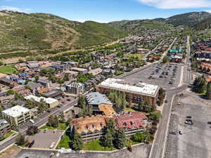 Aerial perspective showcasing a vibrant community nestled among rolling hills