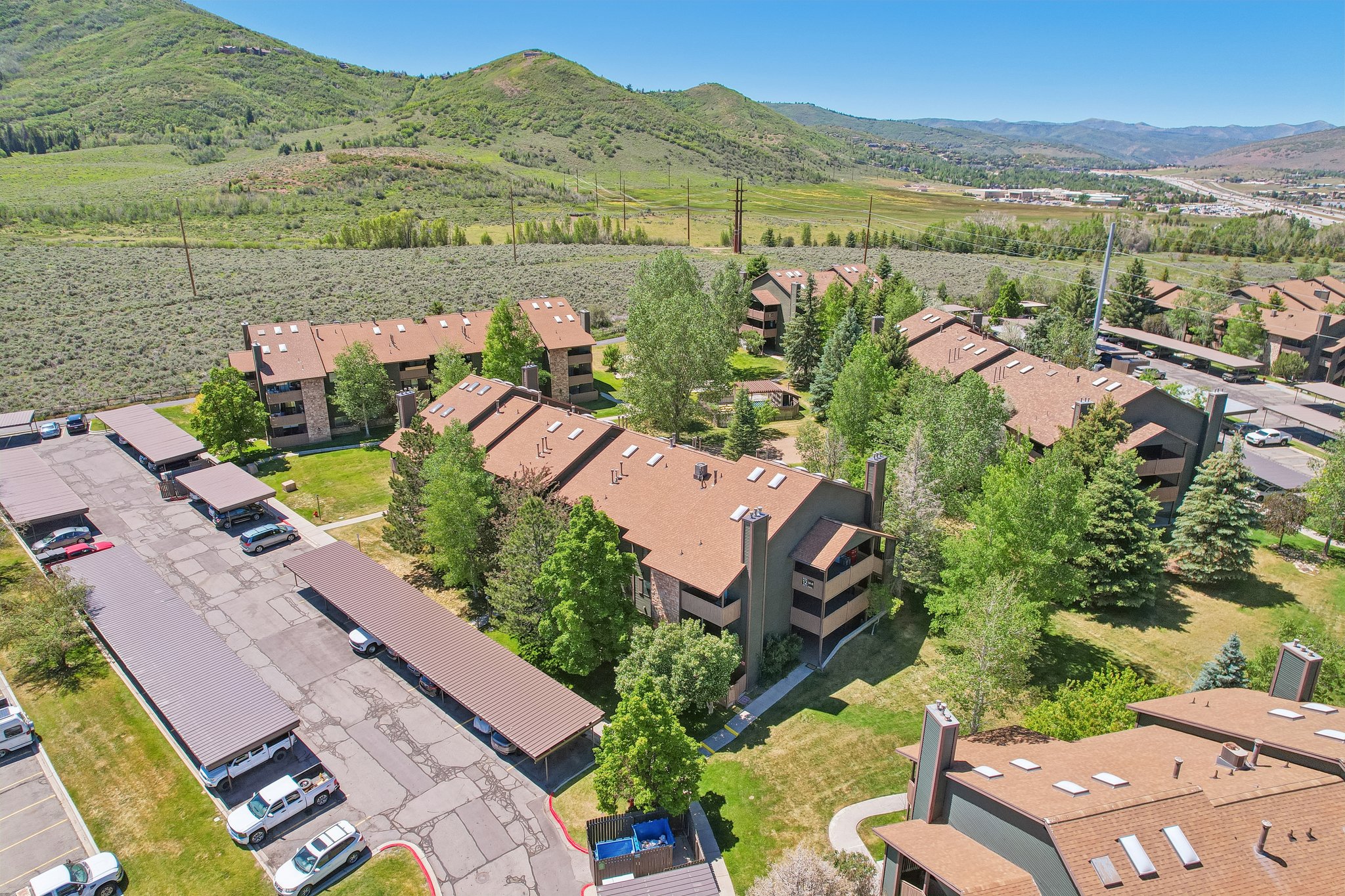 Aerial perspective showcasing multiple residential buildings with complementary architecture