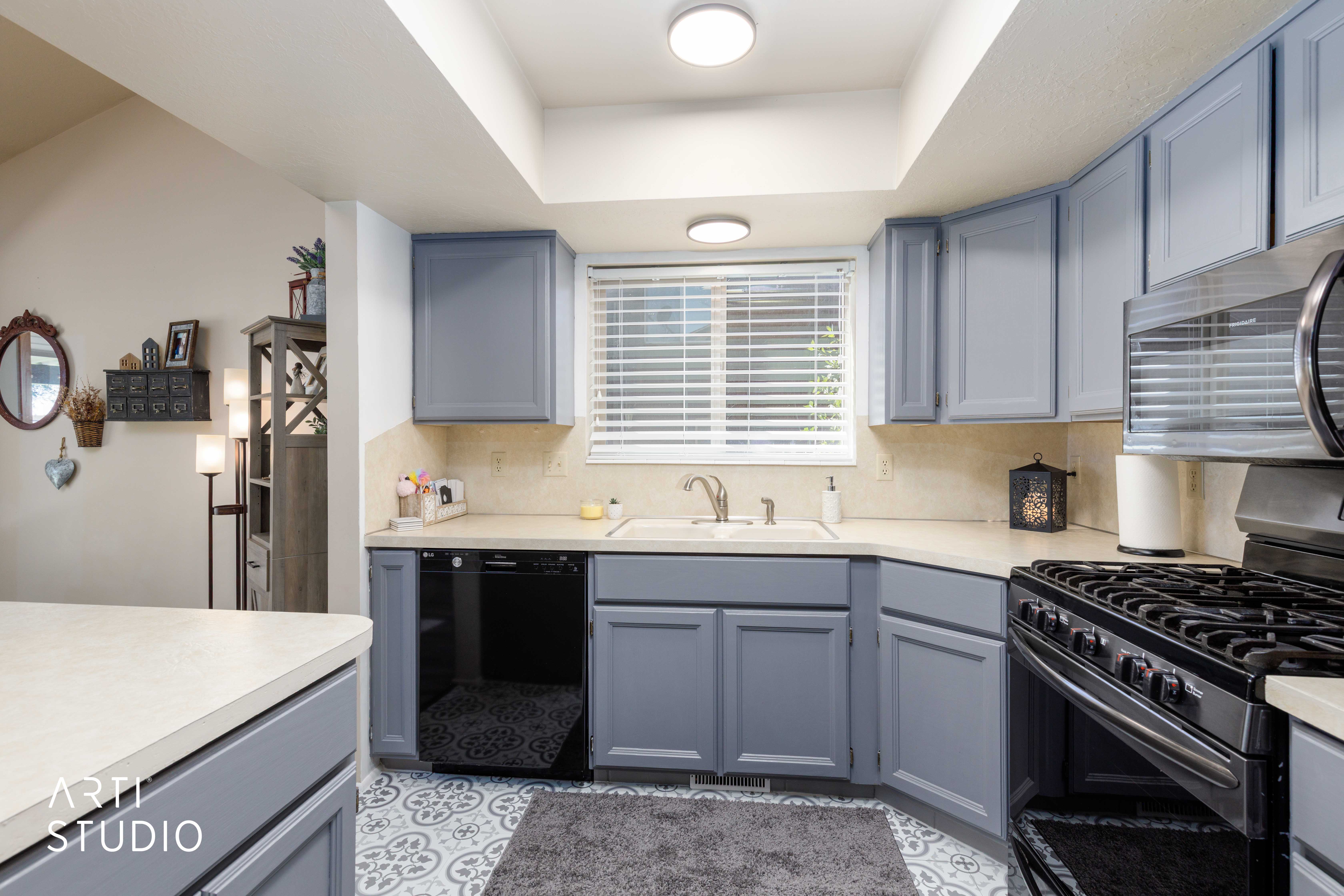 Kitchen featuring a gas range, built-in microwave, integrated dishwasher, and a double basin sink