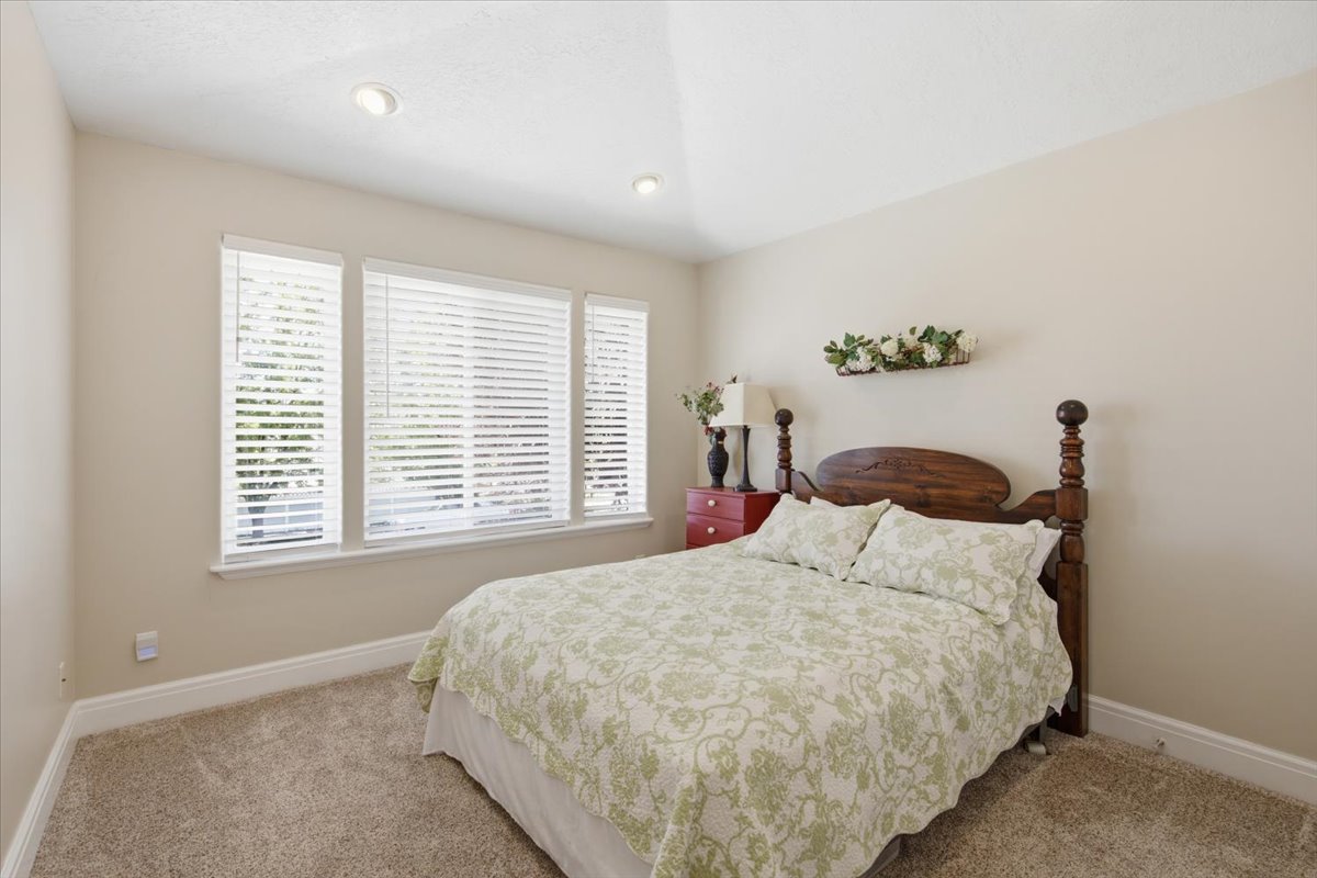 Neutral-toned walls complement plush carpeting