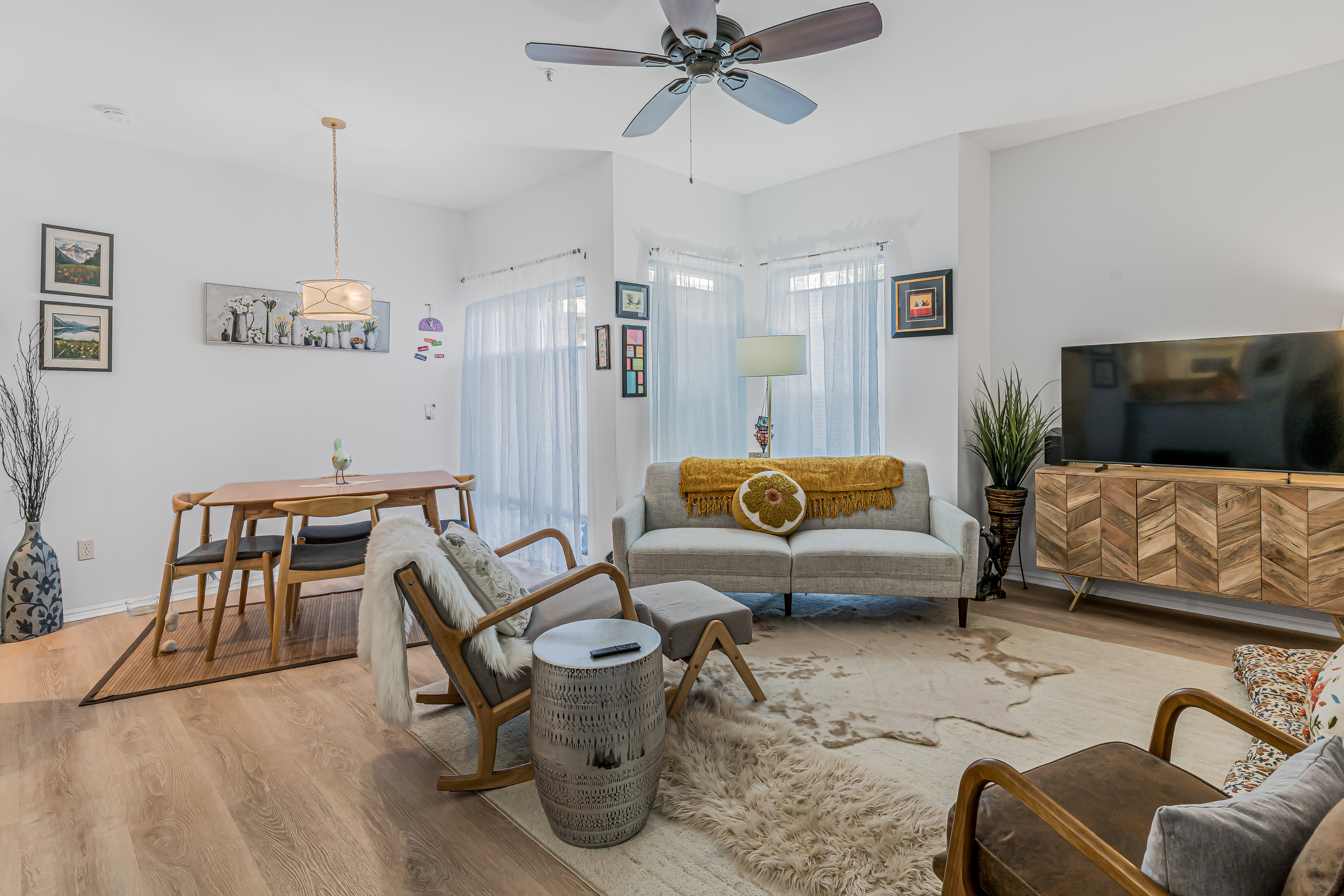 Open-concept living area featuring light wood-finish flooring throughout