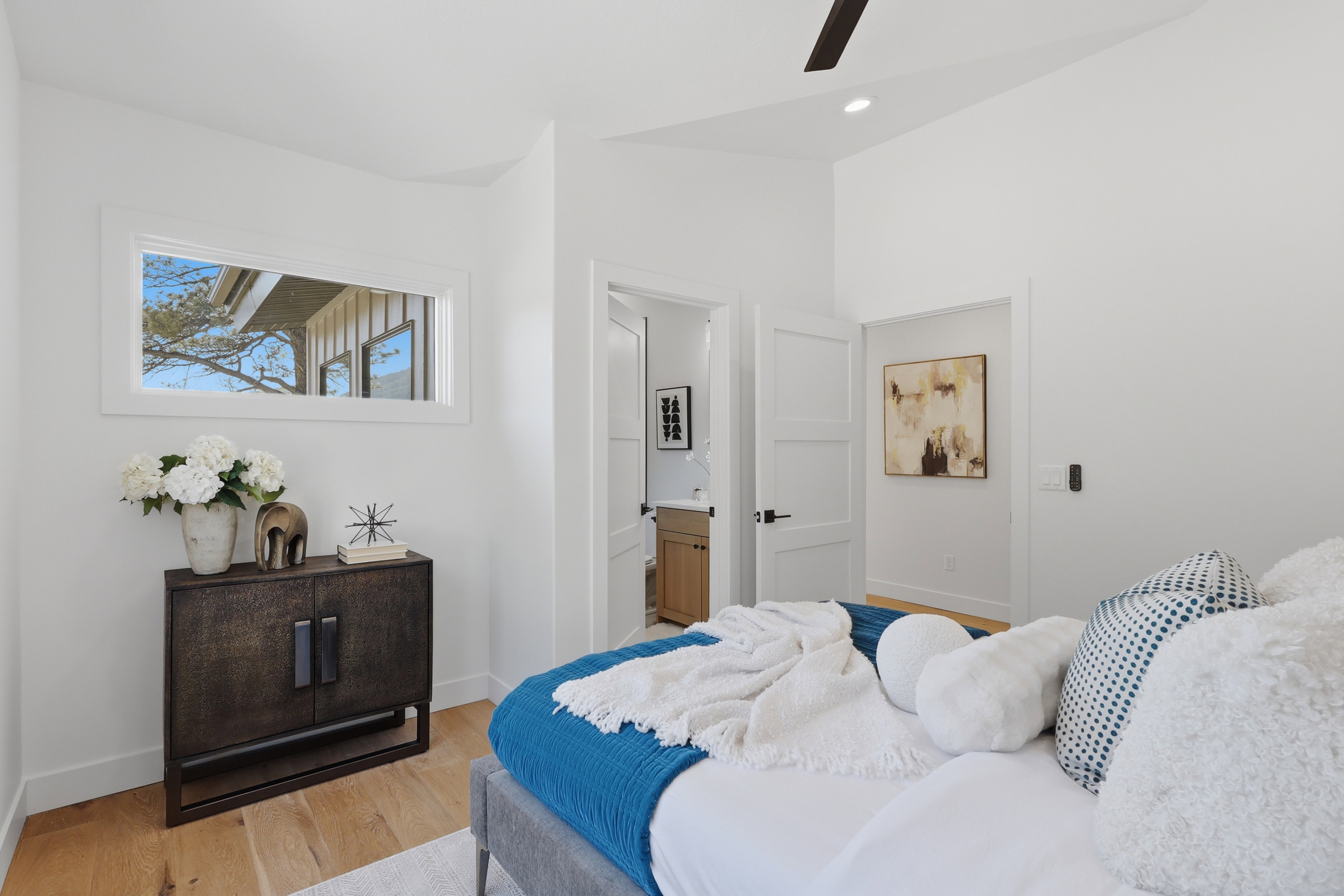 White walls with light wood-finish flooring