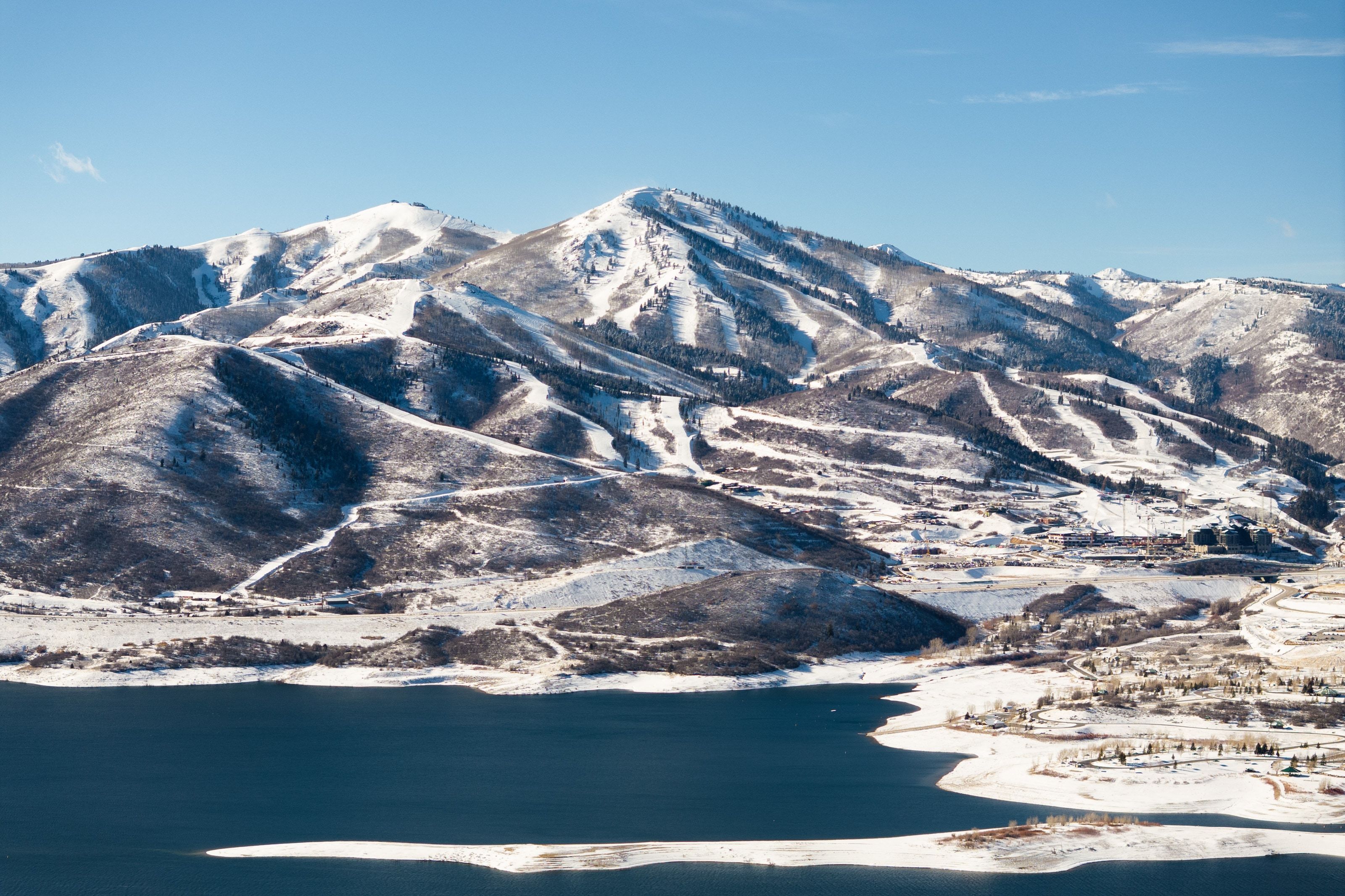 Snow-covered mountains overlooking a large body of water