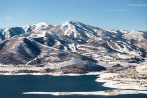 Snow-covered mountains overlooking a large body of water